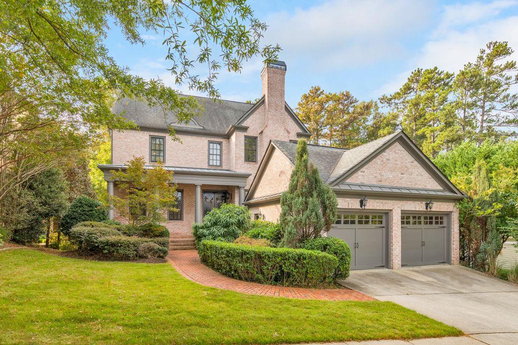 Nestled against the picturesque backdrop of Kennesaw Mountain National Battlefield Park, this exquisite 5 bed / 5 bath custom brick home beckons you to experience a world of luxury and natural beauty like no other. As you step inside, you'll be captivated by the intricate details that grace this beautiful home. The main level extends a warm welcome, unveiling an expansive layout designed to seamlessly blend entertainment and relaxation. A separate dining area sets the stage for gatherings, while a versatile sitting room/office provides a tranquil space. Spend your days sitting fireside in the living room or outside on the back deck while taking in the views of the serene backyard. The heart of this home is the chef's kitchen, adorned with commercial-grade KitchenAid appliances, stunning granite countertops, an expansive island with a breakfast bar, and designer lighting that adds a touch of sophistication. The oversized owner's suite on the second level is a true sanctuary with a wall of windows that flood the space with natural light. A private screened-in balcony allows for peaceful mornings surrounded by nature. The ensuite boasts his/her vanities, a separate shower, and a jacuzzi tub. The spacious walk-in closet is complete with custom shelving. Two generously sized bedrooms are also on this level, one of which features a vaulted shiplap ceiling and overlooks the private loft - a perfect haven for a library and reading nook. This loft leads to yet another loft space, ideally suited for an office. This third level also offers a large bedroom with its own bath - great for a teen suite. The full, daylight basement offers a generous living space, a media room, an expansive bedroom, and a full bathroom. From the basement, step out onto the flagstone patio, an ideal space for grilling out or spending time with family. Throughout the home, newly refinished hardwood floors grace the main level, while plush newer carpeting enhances the terrace level. Enjoy leisurely strolls on trails leading to Kennesaw Mountain, or enjoy the neighborhood amenities that include a pool, tennis courts, and a playground. Easy access to shopping, dining, schools, and major interstates. Don't miss your chance to call this exceptional residence your home!