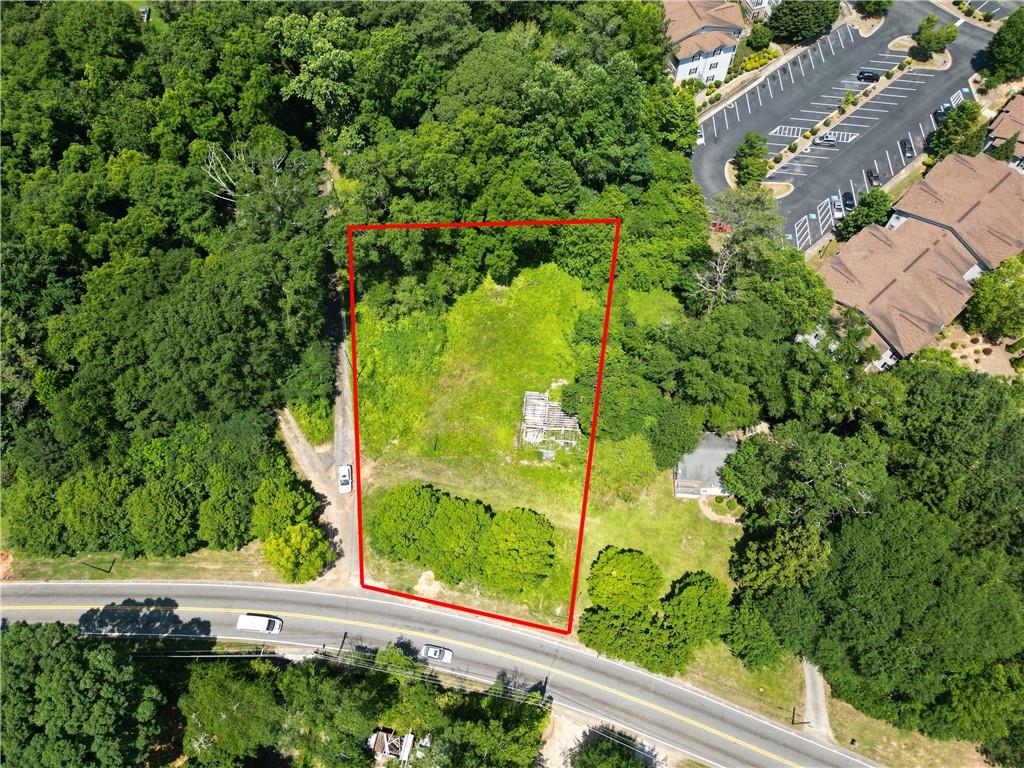 ATTENTION BUILDERS AND INVESTORS! Seize the chance to develop a custom home on this sprawling nearly 1-acre lot at 2789 Jonesboro Rd. Priced at $69,000 and available as-is, this site boasts a pre-completed structural foundation, setting the stage for rapid development. With a potential after repair value exceeding $400,000, this property is a lucrative opportunity. Located merely 5 minutes from Interstate 75 and 10 minutes from Downtown, Midtown, and the Airport, this prime parcel offers the perfect blend of seclusion and convenience, ensuring easy access to top amenities and major transport routes for effortless commuting. The lot is level with minimal clearing needed, and comes equipped with essential utilities like electricity, gas, and water. Take advantage of this exceptional opportunity to craft your dream residence or capitalize on profitable AirBNB ventures with no HOA constraints.
