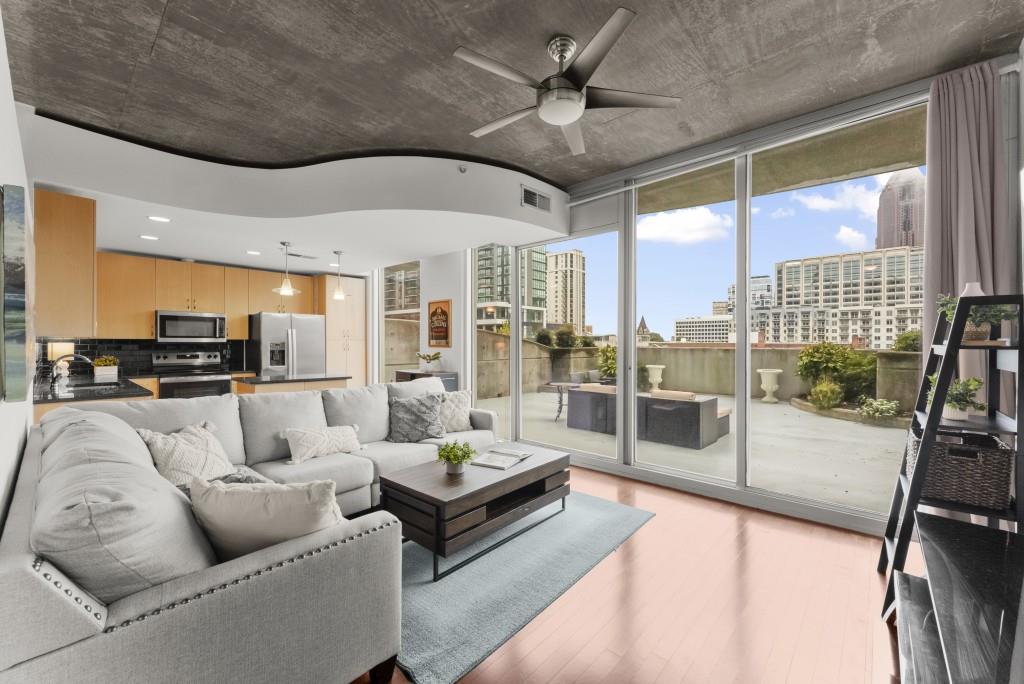 If You are Looking for Peak City Living, You Will Find it in #712 of the Spire Building. This is Spire's Largest Balcony Layout and it will Stun You with the Panoramic View of Downtown Atlanta from your Private Oversized Terrace. Enjoy both Sunrise and Sunset on 450 Square Feet of Outdoor Space Perfect for Hosting a Happy Hour or Relaxing with your Coffee. Spire has a dedicated 24-hour Concierge to Welcome you Every Day as well as Secured Gated Parking. This Unit is Unique with TWO Deeded Parking Spots Directly Across from the Elevator for Easy Unloading and Minimal Time Walking the Garage. The Unit is also on the Same Floor as the Amenities for Ultimate Convenience. The Ease Doesn't Stop at the Door though, Enjoy a Brand New HVAC, Stove, and Refrigerator. The Floor to Ceiling Windows Provide an Abundance of Light All Day and the Walk In Closet is Perfect for Storage. Find Two Floors of Resort-Style Amenities including a Saline Outdoor Pool, Grill and Dining area, Two Fitness Rooms for Cardio & Weights, Club Room with Billiards, Desk Spaces for those who Work at Home and a Media Room. The Location is Unbeatable with all the Midtown Shops and Eateries at your Fingertips with Classic Spots like the Fox Theater or Piedmont Park just Steps Away. Spire is a Social Community with Scheduled Brunch, Comedy Nights, Friendsgiving, Holiday Decorating and more. Nothing else in Midtown Can Beat the Ease, Charm and Terrace Space this Unit has to Offer! Schedule your Showing Now!