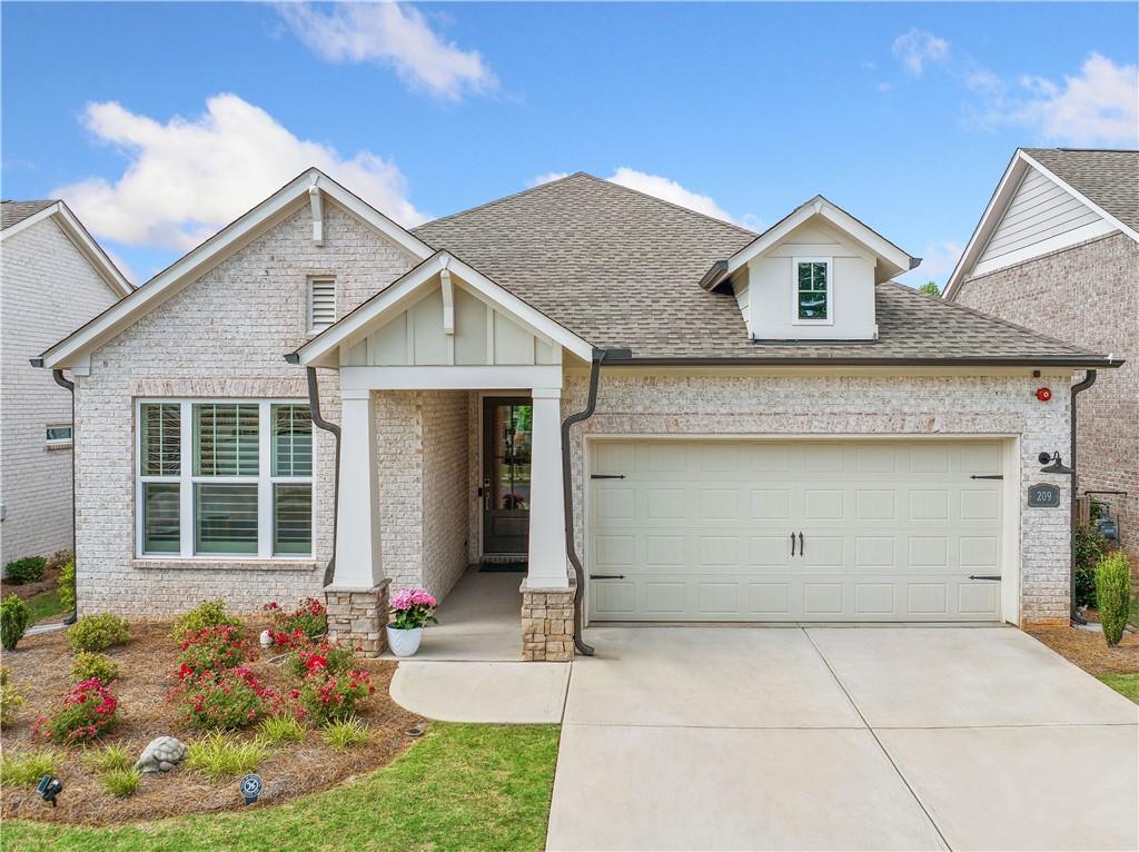 Extraordinary, Stepless Living in Vibrant 55+ Community offers the perfect balance of traditional Ranch style living w/modern aesthetics refined to perfection! Don't wait for new construction, this immaculate home has been meticulously maintained and loaded in post construction upgrades! Step inside to a bright and airy Open Floor Pan w/ soaring 11 ft ceilings and 7 inch Luxury Vinyl Plank flooring! Need the versatility for a home office and guest suite? There's two generously sized secondary bedrooms tucked away from the Owners Suite offering the privacy and flexibility to suit every lifestyle. The heart of the home is a true gathering space- designed for comfort and entertaining! The intriguing kitchen boasts Top-of-the-Line Custom Cabinetry w/ lacquered finish, Professional Grade Stainless Steel Appliances (w/gas connection), 8-foot island w/sparkling quartz counter tops and a DREAM pantry & Spice Niche- handcrafted to maximize storage and functionality! Retreat to the primary bedroom with thoughtfully curated accents including built in bookcase and sidelight windows. This continues into the primary bathroom featuring a Zero Entry, Oversized Glass Enclosed Rain Shower with bench seating and Transom Windows. This home offers the ultimate in Indoor/Outdoor Living as you step outside to the expanded, Covered Patio, with overhead fans- the perfect space to unwind or play with children or pets in the fully fenced backyard! The activities don't stop there! You can vacation from home at the Glenhaven at Ridgewalk amenities! Enjoy the 4500 sq ft Clubhouse w/fully equipped Fitness Center, take a swim in the Pool w/Lap Lanes, play on one of the pristine PickleBall Courts or meander to Olde Rope Mill Park- a true destination for Walking,Hiking, Mountain Biking, Fishing, Kayaking & SO MUCH MORE! Located just 2 miles from downtown Woodstock, this home boasts an unbeatable location in one of Money Magazine's "Best Places to Live in America." Explore Woodstock's charming Main Street, renowned for casual and fine dining, shopping, theater, arts, and year-round free concerts. With easy access to I-575 and the Peach Pass express lane, commuting through Atlanta and to Hartsfield-Jackson Atlanta International Airport is a breeze. Take advantage of Cherokee County's generous veteran and senior property exemptions and make this exceptional home yours today!