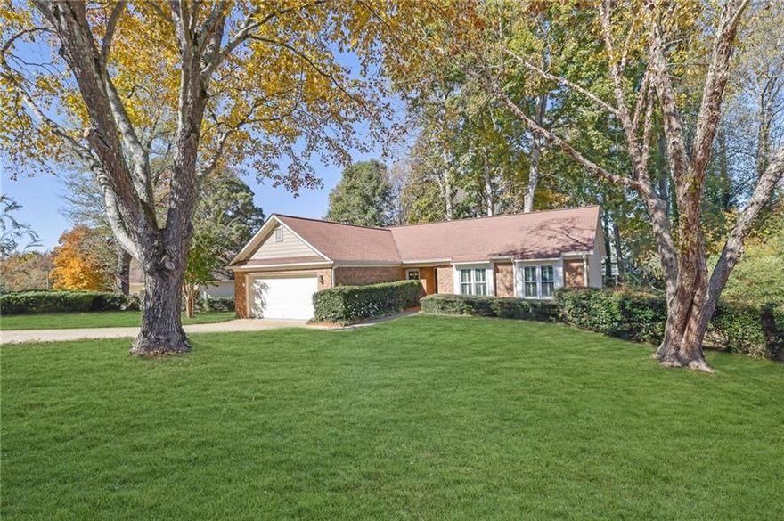 Welcome to this charming one-owner home that has been lovingly cared for and thoughtfully maintained with a FULL KITCHEN REMODEL. Situated on a quiet cul-de-sac road, this step-less brick ranch offers a desirable split-bedroom floor plan designed for comfort and functionality. Step inside to find a versatile flex space ideal for a home office, playroom, or guest room. The open-concept layout allows for a seamless flow between rooms, featuring a vaulted family room with a classic fireplace and French doors leading to a open deck perfect for outdoor gatherings. The inviting eat-in, peninsula-style kitchen offers plenty of counter space and storage thanks to CUSTOM CABINETRY, highlighted by granite countertops, a slate tile backsplash, NEWER stainless steel APPLIANCES, two dining areas, and a convenient serving window. The primary suite provides a peaceful retreat with a double vanity, garden tub, and large walk-in shower. Two additional bedrooms and an additional full bath offer comfort and flexibility for family or guests. Fresh carpet in all the bedrooms. Plantation shutters throughout add timeless charm and character. Light fixtures, ceiling fans, and WINDOWS UPDATED!! Top of the line heating and air with humidifier. Enjoy a private backyard with serene wooded views from the EXTENDED DECK. Swing set and SHED included! With **no HOA restrictions**, you have the freedom to customize your outdoor space to fit your lifestyle. Conveniently located just outside the hustle and bustle, yet close to Town Center at Cobb, KSU, Sam’s Club, and endless shopping, dining, and year-round entertainment.