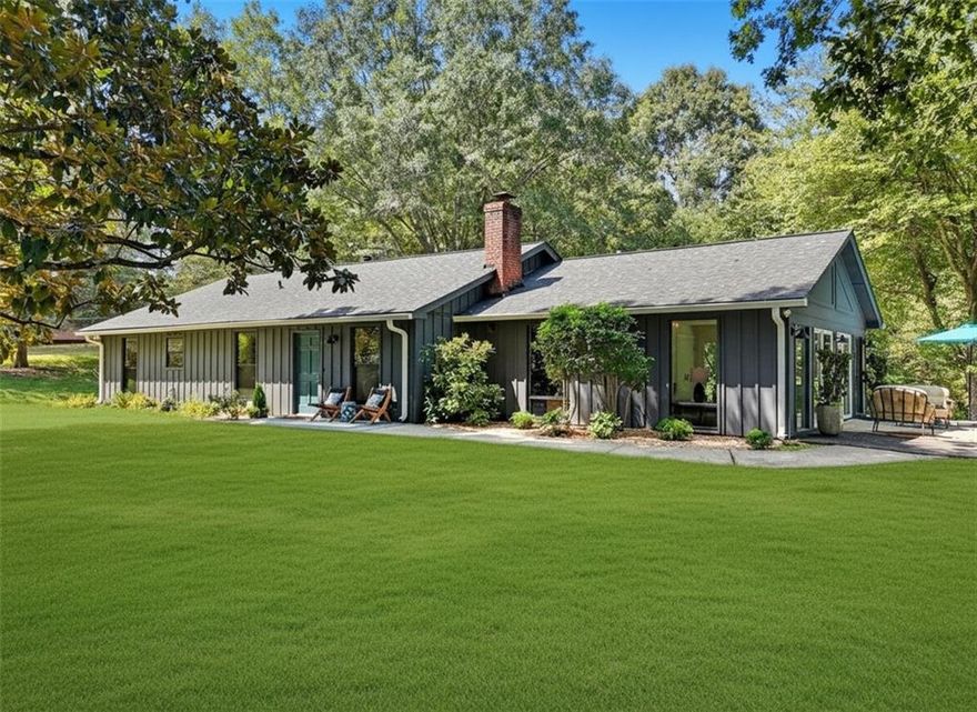 You will LOVE this rare Retreat at 789 Cardinal Cove! Sitting on 3 quiet acres with seasonal views across the street from Lake Cherful in the sought-after Mountain Park community. This beautifully renovated step-less Ranch home with detached garage and an RV parking pad offers a rare combination of space, flexibility, and lake-life charm with no HOA and low Cherokee County taxes. Step inside to find a thoughtfully and beautifully renovated Ranch with 2 bedrooms and a Den/convertible to a 3rd bedroom, 2 renovated full baths, newer kitchen, newer roof, new windows, new flooring, updated electrical and plumbing and fresh interior and exterior paint blending modern finishes with classic comfort. Outside, the property also shines: the home sits privately back from the road and up a gentle, long new concrete drive, the acreage is lush and level as you come up the drive and the large detached garage currently serves as an art studio yet could easily transform into a guesthouse, in-law suite, or income-producing Airbnb. For those with RV's, trailers or boats, you’ll LOVE the dedicated RV parking pad which could also be a unique Airbnb. Enjoy the serenity of your own acreage while being only moments from the water—perfect for fishing, kayaking, or relaxing by the lake. With Mountain Park’s unique, historic small-town vibe, abundant nature, community events like Oktoberfest and July 4th fireworks over the lake and easy access to Woodstock, Roswell, and Atlanta, this property is an ideal blend of retreat and convenience. Whether you’re dreaming of a private homestead, artist retreat, multigenerational living, or a creative investment, 789 Cardinal Cove is a rare find with endless possibilities. Airstream is also being offered for sale. Call for a private showing today!