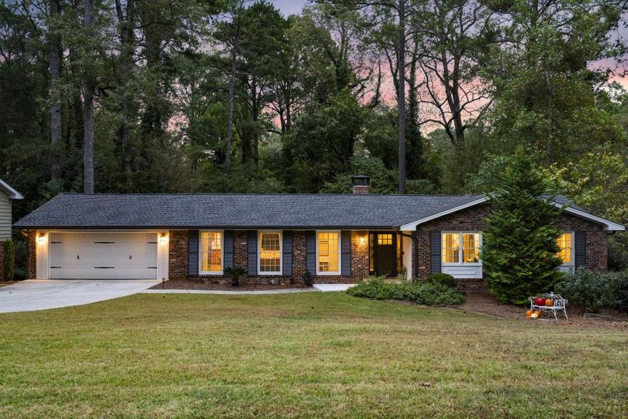 This home may appear to be a classic ranch-but step inside, and you will discover a delightful surprise. The inviting floor plan strikes the perfect balance between openness and coziness, creating an easy flow for both everyday living and entertaining. The chef's kitchen features custom wood cabinetry, new quartz countertops, a stylish backsplash, and updated hardware-all with a view to the comfortable family room. A charming fireplace anchors the space, offering warmth and ambiance during cool fall and spring evenings. A screened porch off the kitchen and dining area provides a serene view of the surrounding woods making this an ideal spot to enjoy morning coffee or host friends for a relaxed evening. Renovated bathrooms bring a touch of modern luxury, while rich hardwood floors create a warm, cohesive feel throughout this home. Expansive terrace level, filled with natural light, flows through double French doors to another deck and extends your living options with a flexible layout. The convenient kitchenette and full bathroom create a superb space for a private suite when guests, friends or extended family visit. Nestled among mature trees, this home feels like a private retreat yet minutes from premier dining, boutique shopping, and major highways. In an exceptionally friendly and established community, you will enjoy both tranquility and convenience-a rare combination that defines modern luxury living.