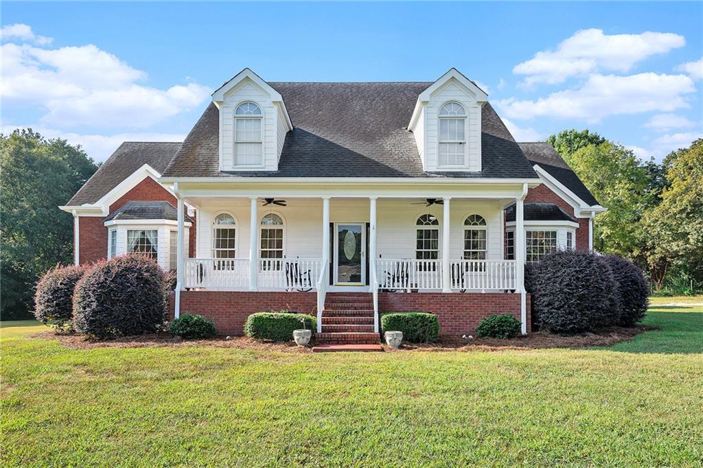 Over 3 acres of usable land in a great location! Custom home with high ceilings and loads of natural light. Hardwood floors. Oversized master suite on the main with separate sitting room. New composite deck. Large garage with workshops and plenty of storage space for all of your equipment. Seller will replace the roof with a full price offer and allow buyer to select the shingle color. Don't miss your chance on this one!