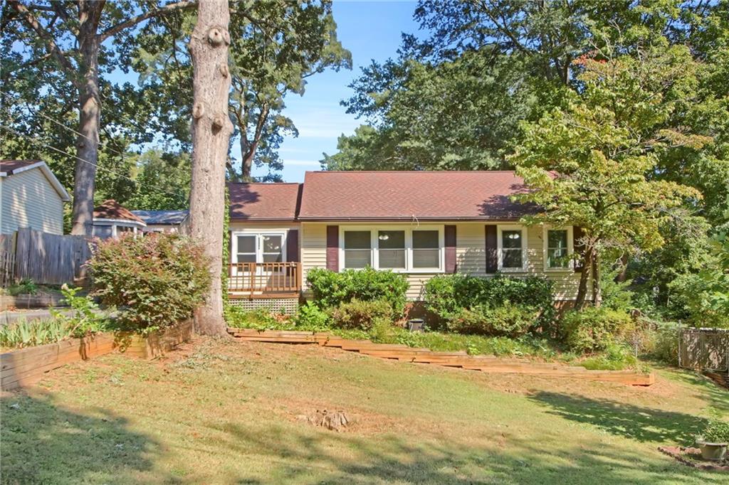 Welcome to this 3-bedroom, 1-bath home in the well-established Green Acres neighborhood of Smyrna. Nestled on a rare oversized level lot just inside the I-285 perimeter, this mid-century gem offers all the character of a mature community with plenty of room to grow. A spacious bonus family room provides flexible living space, while the screened-in porch and large deck invite you to relax or entertain outdoors. The crawl space is more than storage — with electricity in place, it’s the perfect setup for a workshop, man cave, or hobby space. Green Acres is one of Smyrna’s most convenient and affordable neighborhoods, close to schools, shopping, restaurants, parks, and major highways, giving you easy access to everything the city has to offer. Whether you’re a first-time buyer or looking for a home you can update to your needs, this property is a wonderful opportunity to enjoy all that Smyrna living has to offer.