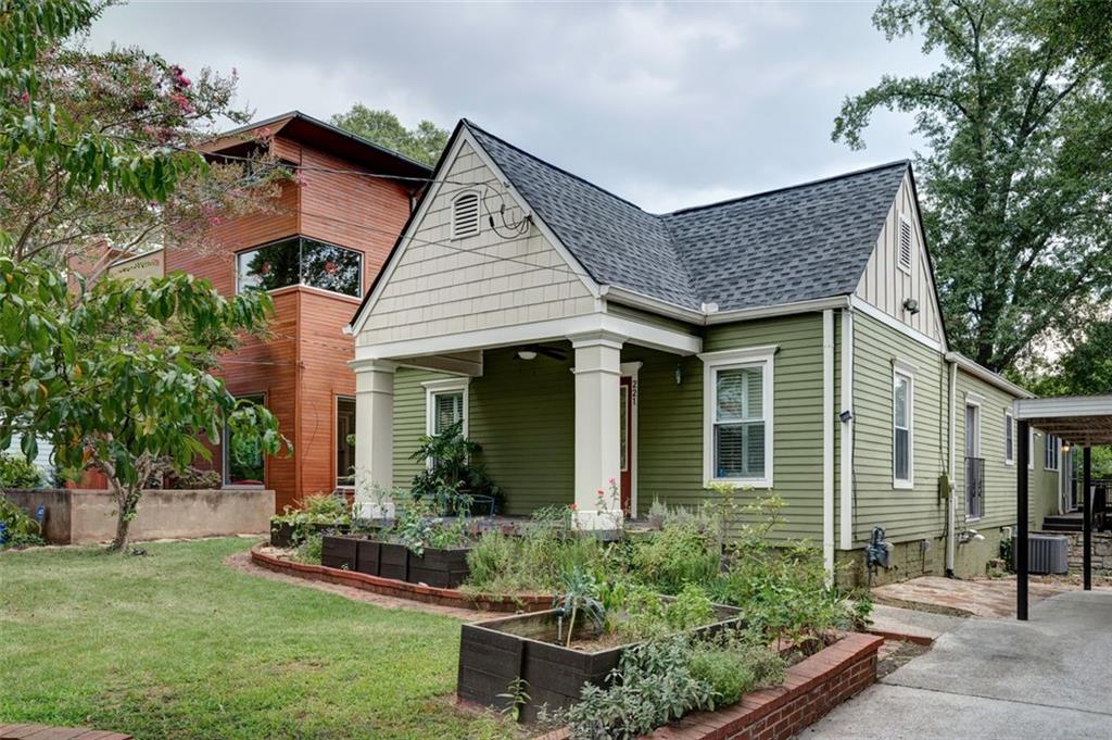 This beautifully maintained home blends timeless character with modern comfort in one of Decatur’s most sought-after neighborhoods.
A charming front porch welcomes you into a cozy living room at the front of the home, ideal for quiet mornings or intimate gatherings. In the rear, a stunning great room wows with vaulted ceilings, exposed beams, a wall of windows, skylight, and built-in shelving—perfect for everyday living and entertaining.
At the center of the home, the chef’s kitchen features a large island with custom range hood, premium Wolf range, stone countertops, stylish backsplash, peninsula seating, and a wine cooler.
With spacious living areas, thoughtful updates, and undeniable charm, this home offers the perfect blend of classic style and modern living. See it today!