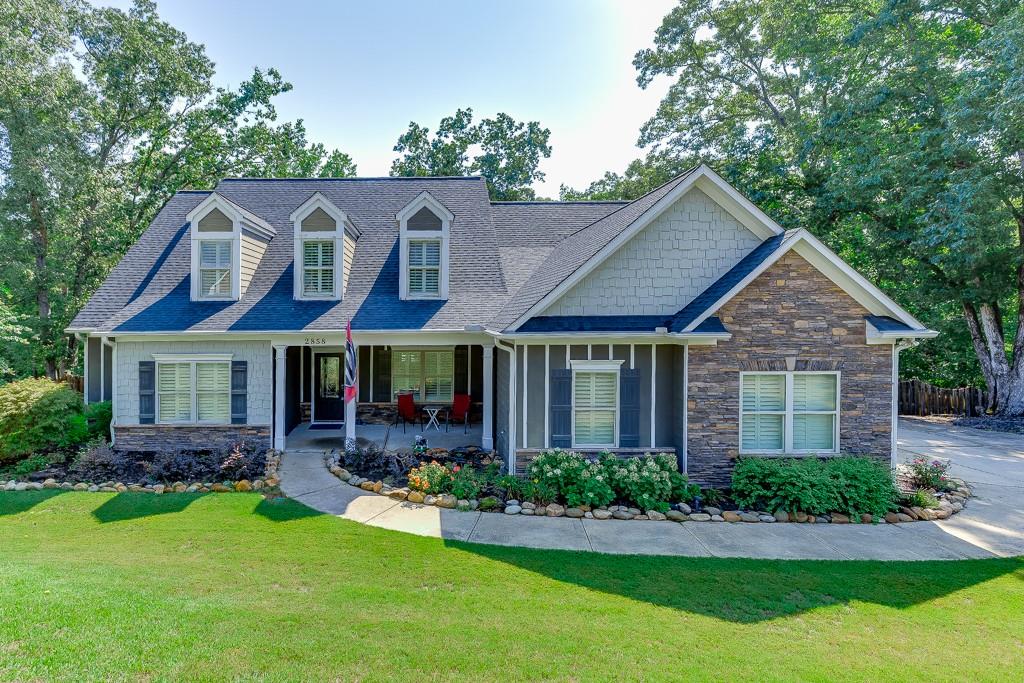 Freshly painted and move-in ready, this beautifully maintained ranch in Shadowstone Estates offers 5 bedrooms and 4 full baths on over 1.2 acres. Inside, you’ll find an open layout featuring solid bamboo flooring in the foyer and great room, a spacious dining room, and a chef’s kitchen with granite countertops, ceramic tile flooring, a breakfast area, bar seating, and stainless steel appliances. Upgrades include plantation shutters, newer carpet with upgraded padding in all bedrooms, and an oversized 5th bedroom/bonus room with a private bath—perfect for guests or a home office. The home also features a newer roof with architectural shingles. Enjoy the large back deck overlooking the private, wooded lot—complete with creek access and a waterfall feature. Located near parks, schools, and Chateau Elan with easy access to I-85.