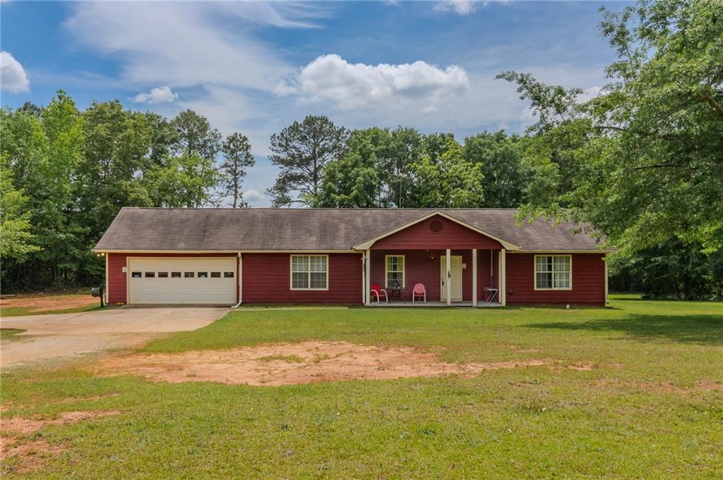 Welcome to 1170 Peeksville Road - Locust Grove, GA 30248 Nestled on 2 private acres in the heart of charming Locust Grove, this beautifully maintained 2-bedroom, 2-bath ranch offers 1,382 sq ft of inviting living space, all on one level. Built in 1997, this home features an open-concept layout, updated HVAC, roof, and hot water heater-providing comfort and peace of mind from the start. Step outside and discover a backyard surprise-a true man cave's dream! This impressive two-story workshop offers ample space for storage, workshop projects, hobbies, or creating the ultimate hangout zone. Whether you're a car enthusiast, craftsman, or collector, this space is ready to be transformed to suit your lifestyle. Additional features include: 2-car attached garage Spacious front and back yards Quiet, peaceful setting perfect for nature lovers or those seeking room to roam No HOA Why You'll Love Locust Grove: This home is just minutes from I-75, making commutes to Atlanta a breeze. Enjoy small-town living with big-time perks-like Tanger Outlets for shopping, Southern Belle Farm for year-round family fun, and Noah's Ark Animal Sanctuary for a unique local treasure. Parks, great schools, and community events make Locust Grove a place people are proud to call home.