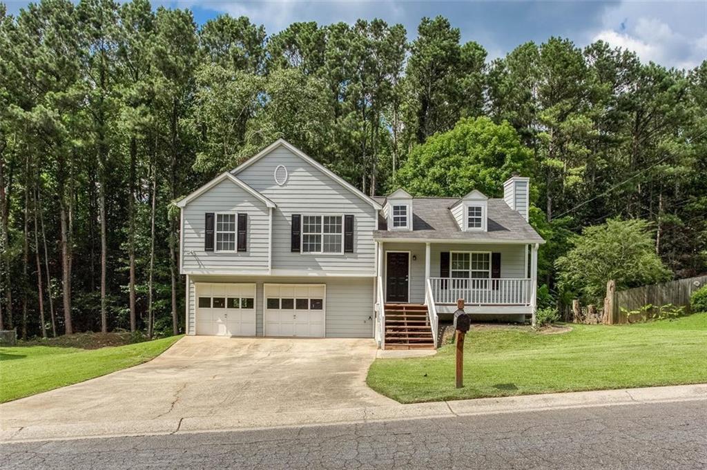 Movin ready home, a short drive to the downtown Woodstock area, conveniently located near the intersection of Bells Ferry Rd and Eagle Dr. New kitchen appliances, updated flooring, freshly painted interior, upgraded and freshly painted exterior, and all systems working properly, so you have peace of mind when you make your purchase and move into your new home. There’s plenty of space in the yard for fun and activities, and a large back deck that’s great for get togethers. Three bedrooms and two full bathrooms, kitchen, dining area, and family room with gas fireplace, plus finished two car garage, with ample space for storage or parking. In the last five years, the current owner, who is also the original owner, has invested over $74,000 making sure it’ll be ready for you. The pride of ownership shows and will be appreciated by the new owner.
Upon entering, the main room feels spacious and open with a large, vaulted ceiling that connects to the dining area and kitchen. Ample countertop space and storage, including a pantry in the kitchen, make for an ideal area when entertaining guests or preparing day-to-day meals. Flowing out to the back deck, you’ll find room for your outdoor furniture and an umbrella, where you can enjoy gatherings and activities throughout the year. Headed up the stairs, guests have access to the hall bathroom, which also serves the two secondary bedrooms, and then the primary suite for the owner has its own private bath and sizable closet. Additionally, there’s a linen closet for extra storage
Lastly, in the garage, there’s plenty of room for two cars, a workbench, or an activity center like a home gym or arts and crafts area.
The yard has been well taken care of with unnecessary trees that were too close to the house having be recently removed and can be fenced for your four-legged loved ones’ safety. Plenty of sunlight and space also makes it a great set up for container gardening, playground, and possibly a pool. Let your imagination run wild.