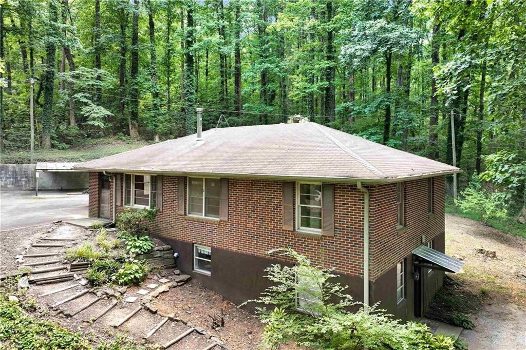 Tucked Away Treasure This private 3-bedroom, 2-bath home offers SPACE to GROW, with three additional rooms in the basement-perfect to finish a guest space, home office, or hobby rooms. The layout is both FUNCTIONAL and FLEXIBLE, designed for COMFORTABLE living. Step outside to ENJOY your own slice of CHARM with a shed, EXPANSIVE parking and barn...ideal for a workshop, STORAGE, or that dreamy CREATIVE studio you've always wanted. The POSSABILITIES here are endless! Whether you're looking for PRIVACY or SPACE to CREATE and EXPAND, this property is for you!