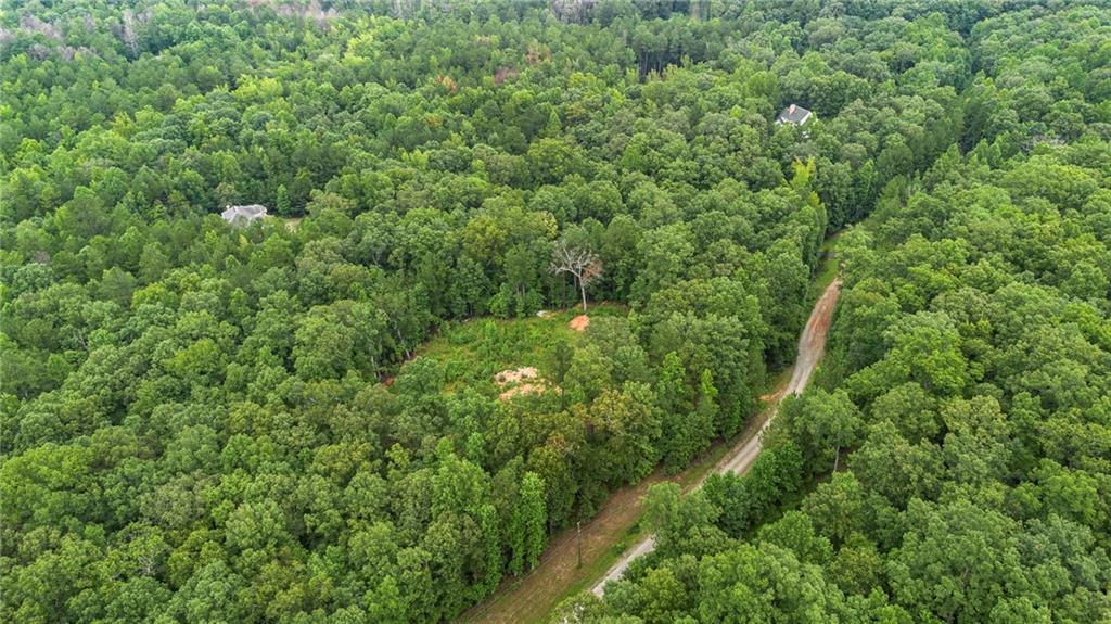 Explore this highly desirable Residential Lot and create your ideal home. Located less than 30 miles from Atlanta and Hartsfield Airport, this property spans 6.25 Acres and is prepared for construction. A soil test and survey are available, confirming the land's readiness for building. The property is connected to public city water, offering the buyer a wonderful sense of privacy along with ample space to enjoy. This presents an excellent opportunity for investors or buyers eager to realize their dream.