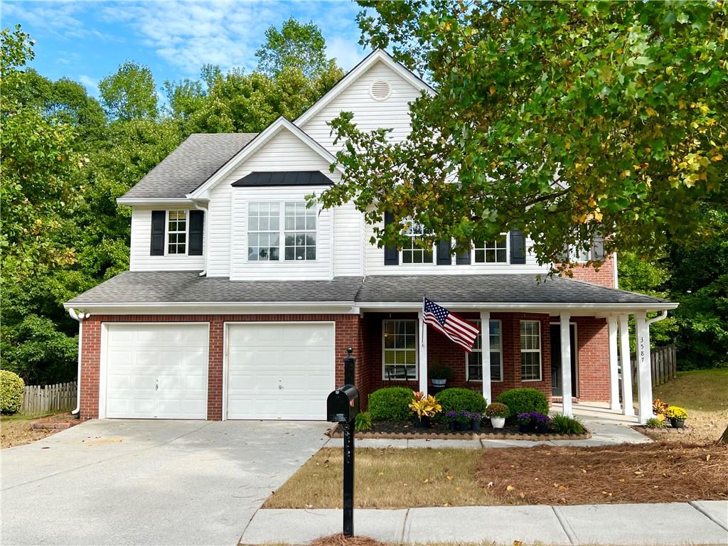 BACK ON MARKET after buyer financing fell through! This is your chance! PRICE IMPROVEMENT! BRAND NEW HVAC systems were just installed for upstairs and downstairs in April 2024! BRAND NEW CARPET installed 9/25/2024!!! This beautifully kept, 2001 Traditional home, in the new Seckinger High School cluster, is move-in ready! There are 3 generously sized bedrooms upstairs with a shared full bathroom, along with an Oversized Primary Suite, including a large walk-in closet, soaker tub, and separate shower. Laundry is conveniently located upstairs as well! The spacious kitchen with a center island and large pantry, is open to the family room and wood-burning, marble surround fireplace. Also on the main floor are a powder room; separate living room, and dining room, either of which can be used as a home office. Situated at the entrance of the cul-de-sac, there is a rocking chair ready, covered front porch; and a well maintained, fenced-in, terraced back yard that overlooks a beautiful trickling stream. The owners are leaving the storage shed and dog house for you, along with the (purchased in 2022) washer and dryer in the laundry room! Architectural shingle roof was installed in 2012. Don't miss out on this perfectly PRICED TO SELL home!