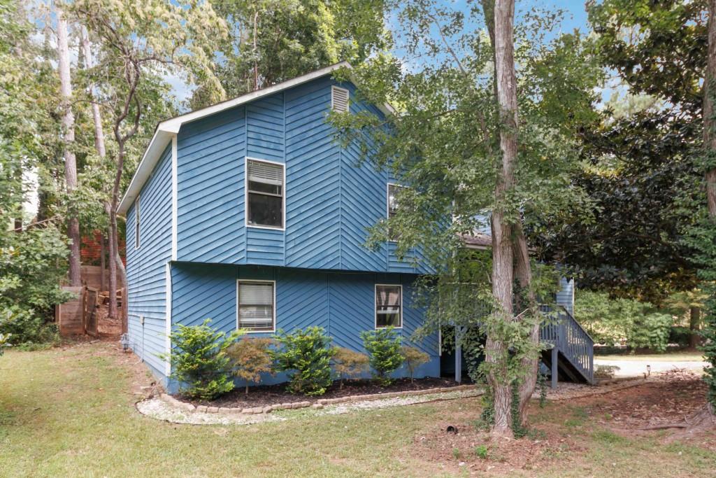 Spacious Split-Level Home with Great Potential! This 4-bedroom, 3-bath split-level home offers a fantastic opportunity to create your dream space! Nestled in a quiet neighborhood, it features a charming front porch, a covered back deck perfect for relaxing or entertaining, and a fully fenced backyard with room to play, garden, or gather. Inside, the home offers a versatile layout with generous living areas and plenty of natural light. While it does need some repairs, it's a great opportunity for buyers looking to add their personal touch or investors seeking a valuable project. Don't miss the chance to make this home your own and build instant equity schedule your showing today!