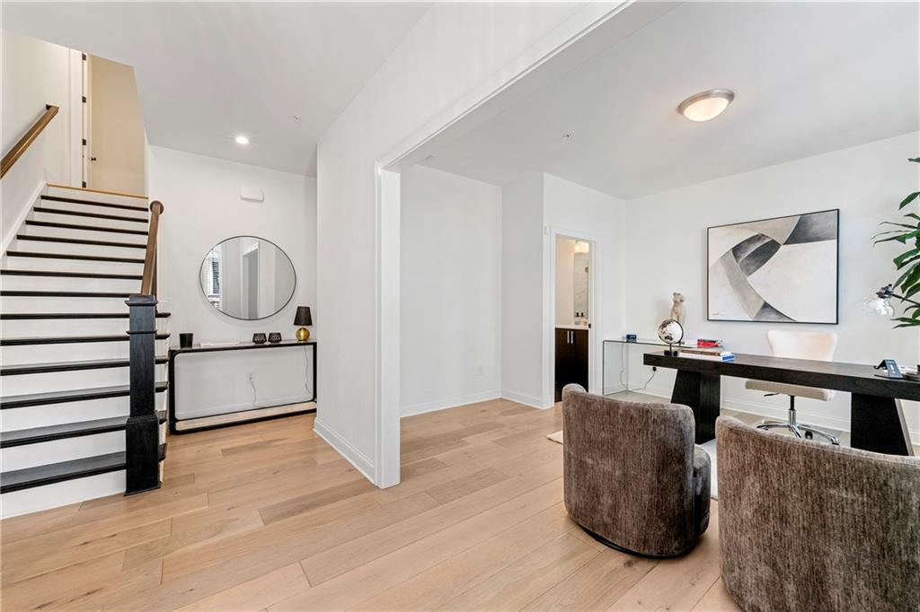 The perfect blend of sophistication and convenience in this stunning four-level townhome located in the heart of Alpharetta. This luxury residence is thoughtfully designed for elevated living—literally. A private in-home elevator effortlessly transports you between all floors, from the terrace level to the top-floor retreat.
Step inside to find high-end finishes throughout, including gleaming hardwood floors, quartz countertops, and designer lighting. The open-concept main level features a chef’s kitchen with premium appliances, spacious dining and living areas, and abundant natural light. Upstairs, the expansive primary suite offers a spa-inspired bath and generous walk-in closet.
Whether you're entertaining guests on the private rooftop terrace or working from the flexible bonus spaces, every detail supports a lifestyle of comfort and style.
Located just minutes from downtown Alpharetta, Avalon, and top-rated schools, this is urban luxury in a prime suburban setting.
Bonus: No more hauling groceries or luggage—your elevator makes every floor easily accessible.
Don't miss this rare opportunity to own a home that combines upscale design, smart functionality, and unbeatable location.
-Furniture has been removed.