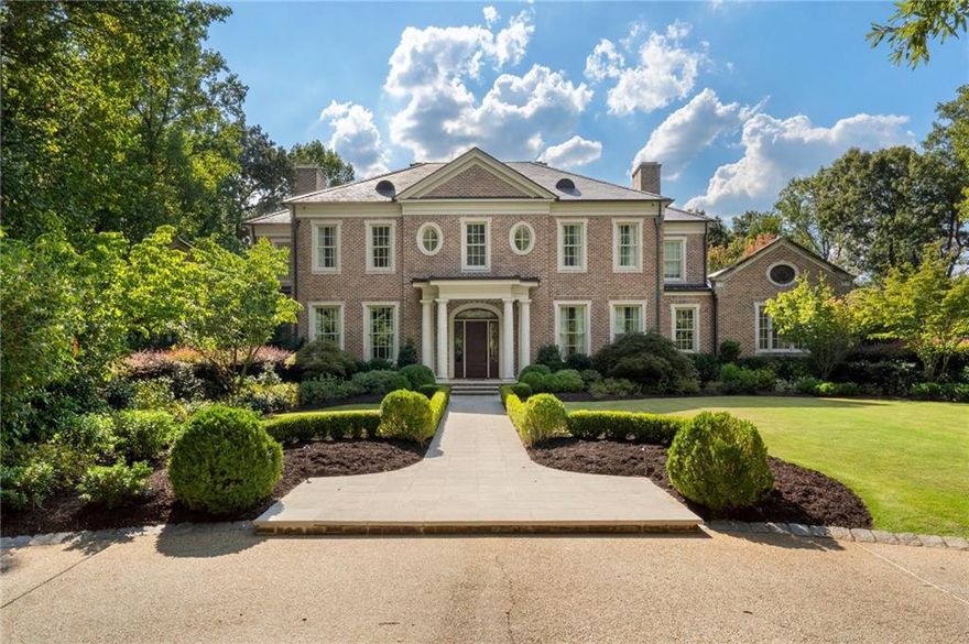 Discover this exceptional custom estate, masterfully designed by renowned architect Harrison Design and acclaimed interior designer Suzanne Kasler. Privately nestled on 2.4 gated acres in the heart of Buckhead, this stunning home offers the ultimate in luxury living, privacy, and convenience.

Built by esteemed Beecham Builders, the residence showcases superior craftsmanship and attention to detail throughout. A true entertainer’s dream, the expansive floor plan includes a five-car garage, full-size elevator servicing all three levels, whole-house generator, wine cellar, home theater, and a private guest apartment complete with a kitchenette—perfect for an au pair, nanny, or in-law suite.
The main level features a lavish primary suite with a fireplace, spa-inspired bathroom, dual walk-in closets, and a private den. The chef’s kitchen is outfitted with top-of-the-line appliances and opens to a fireside keeping room and sunny breakfast area. Entertain in style with a large formal dining room, elegant living room, spacious butler’s pantry, bar, and walk-in food pantry. Upstairs, you’ll find four generously sized en-suite bedrooms and an additional living space—ideal for a playroom, teen lounge, or study area.
The fully finished daylight terrace level opens directly to the pool and outdoor living areas, and features an additional guest suite, a second laundry room, billiards room, full bar, and seamless indoor/outdoor entertaining spaces.
Enjoy year-round resort-style living with three verandas overlooking the pool, bluestone terraces, and a covered loggia with outdoor fireplace and TV—all surrounded by lush, professionally landscaped grounds.
Perfectly located just minutes from Buckhead’s premier shopping, dining, and top-rated private schools, this extraordinary estate offers unparalleled luxury in one of Atlanta’s most sought-after neighborhoods.