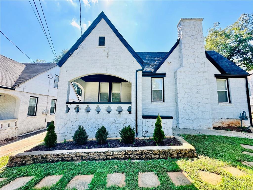 Priced to Sell! Tucked just blocks from the BeltLine’s Westside Trail, Lee + White’s food hall, and beloved local spots like Gordon White Park and Monday Night Garage, 1622 Beecher places you in the heart of one of Atlanta’s fastest-growing neighborhoods. With continued investment and development all around, it offers not only comfort and charm, but lasting value in a location on the rise. This beautifully renovated 1940s brick Craftsman bungalow offers hard-to-find features including a detached garage with EV charging station and not one, but two inviting porches perfect for morning coffee or evening wind-downs. Step inside to an open, sun-drenched layout with gleaming hardwoods, high ceilings, and custom recessed lighting throughout. The living room centers around a charming decorative fireplace, while the renovated kitchen shines with quartz countertops, stainless steel appliances, and generous cabinet space. A separate dining area adds warmth for gatherings, and the spacious, well-appointed bedrooms include updated closets. Enjoy a large private yard with plenty of room to entertain, play, or create your dream outdoor setup. The detached garage, a rare find in the area, offers secure parking and extra storage, along with a full Ring security system already in place.