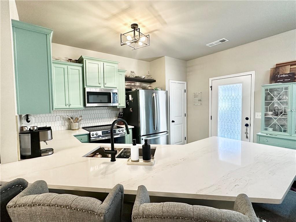 Beautifully renovated 3 bed, 2.5 bath home in Holly Springs featuring all new stainless steel appliances, quartz countertops, tile flooring on the main and LVP upstairs, remodeled bathrooms, and new lighting throughout. Enjoy an open floor plan, spacious bedrooms, and a low maintenance turf backyard perfect for entertaining. Conveniently located just minutes from Downtown Woodstock and Downtown Canton, with quick access to I-575 (Exit 14), Publix, Kroger, Canton Marketplace, and The Outlet Shoppes at Atlanta. Move-in ready and close to shopping, dining, and entertainment!