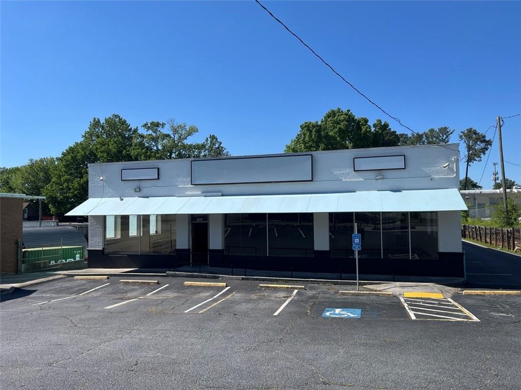 Please view attached video link of entire interior of space in VIRTUAL TOUR .
This building was previously a retail store with a pharmacy however, with its open floor plan it can be a RETAIL SPACE/ SHOWROOM RESTAURANT, LOUNGE, CLUB, SALON OR SALON SUITES, EVENT HALL/ FACILITY, PRODUCTION & RECORDING SPACE/ STUDIO, FITNESS/ WELLNESS STUDIO, CLINIC, MEDICAL/ HEALTH USE, DAYCARE, TRAINING FACILITY, CREATIVE OFFICE, ANIMAL DAYCARE/ BOARDING, ETC. This brick building has excellent visibility on Cheshire Bridge Rd. It is a thoroughfare connecting Interstate I-85 and Piedmont Rd.and is in the Morningside area of Atlanta,located in between Buckhead and Midtown submarkets. The property has parking in the front, side and rear with a drive -up ramp and a dock in the fenced in rear. The building has large display windows in the front with up to 20 window spaces in the rest of the building. It went through a major renovation in 2016 into a very functional and modern space which can be adapted to MANY uses. It has never used signage availability at a few locations on the building and a two-sided pole sign to attract a lot of attention on this Atlanta thoroughfare. The property has 20 existing parking spaces but there is a portion in the rear property which can be converted into 15-18 additional parking spaces (35-38 total) if needed and potentially more nearby. It also has a fenced in area with a dock and a ramp in the rear of the building. Owner is a licensed agent.