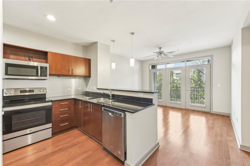 Discover urban living at its finest in this stunning 1-bedroom, 1-bathroom condo, perfectly located in the vibrant heart of Atlantic Station. This light-filled unit features beautiful wood floors, stylish stained cabinets, and ample storage throughout.
A wall of windows floods the space with natural light and opens to your private balcony, offering the perfect spot for morning coffee or evening relaxation. The spacious primary bedroom also has direct balcony access and boasts an ensuite bathroom with a separate shower and soaking tub for ultimate comfort.
Enjoy the convenience of a gated parking garage with a reserved parking spot, in-unit washer and dryer, and access to a suite of top-notch building amenities, including a pool, fitness center, and lounge.
Situated in the sought-after Element community, you’ll be steps away from an array of shops, restaurants, parks, a movie theater, and so much more. Whether you’re looking for convenience, comfort, or a lively lifestyle, this condo has it all!
Don’t miss the opportunity to make this your new home—schedule a showing today!