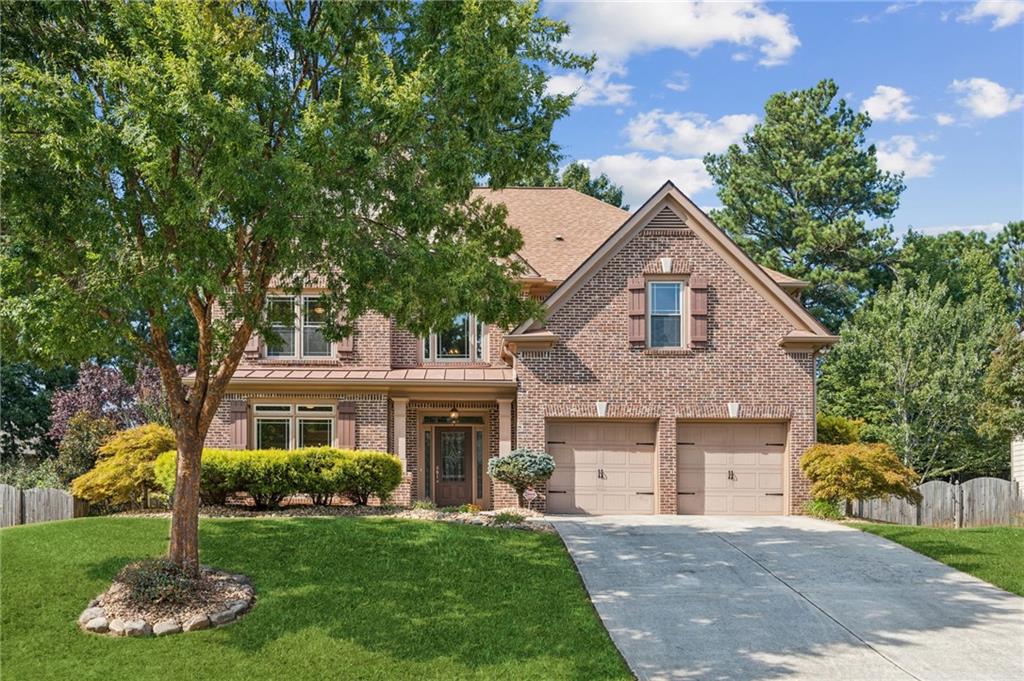 Immaculately maintained home with modern upgrades in a sought after community. This beautifully cared for home offers peace of mind with all major systems recently replaced including the roof, HVAC, water heater, and every window throughout the home. Once you step into the home you will be wowed by the grand 2 story ceiling in the foyer. Gleaming hardwood floors flowing throughout the main level where you will also find a welcoming guest bedroom and full bathroom, perfect for visitors or multi-generational living. The main floor also features a formal living room, formal dining room, and a kitchen with eating area overlooking the gorgeous fireside family room with built ins and a coffered ceiling. Enjoy year round relaxation on the spacious screened in porch, featuring a stunning tonge and groove wood ceiling and serene views of the private, fenced back yard. Upstairs, 2 generous secondary bedrooms are connected by a Jack and Jill bathroom with double vanities and separate closets. The grand primary suite is located on the other side of the home and it impresses with a wall of windows, a large sitting area, and an oversized spa like bathroom with a huge walk in closet. Set in a family friendly neighborhood, this home is ideally located near top rated schools, shopping, and dining. You will not find a better cared for home!