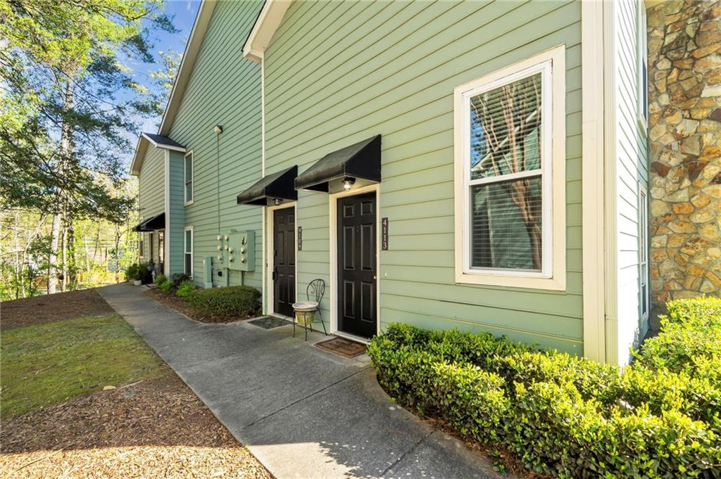Welcome Home to Canyon Point Residences! This beautifully updated 2-bedroom, 2-bathroom end-unit condominium in the sought-after Canyon Point community offers comfort, privacy, and convenience. With no neighbors above and excellent location, this top-level home welcomes you with a spacious 2-story foyer and an open-concept layout. The unit is move-in ready with all appliances included, and the building features a newer roof, fresh interior paint, new plush carpet and a newly upgraded balcony railing. All windows and patio sliding door replaced. Canyon Point provides resort-style amenities such as a salt swim pool and tennis/pickle ball center, a private dog park, and well-kept common areas. Enjoy the convenience of walking to East Roswell Park, the Chattahoochee River, Centennial Kroger, East Roswell Library, Holcomb Bridge Post Office, and more, with easy access to GA-400. 100% Financing Available. Low HOA fees covers: water, sewer, trash, exterior pest control and all maintenance amenities, As a bonus, the community’s 20% rental cap has not been met, so this unit qualifies as an excellent rental property opportunity.