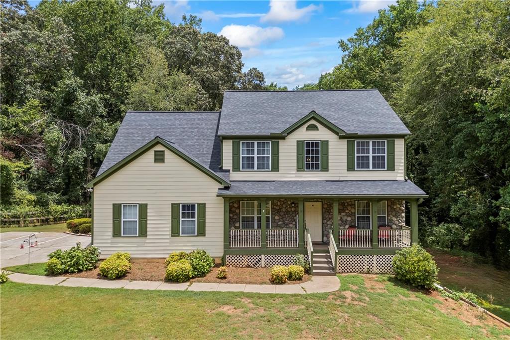 Discover this stunning, move-in-ready home in the highly desirable Timberline at Lake Lanier community. Nestled on over an acre, this 5-bedroom, 3-bath residence offers the perfect blend of comfort, privacy, and convenience. Freshly painted throughout, the main level includes a guest bedroom and full bath, along with a warm and inviting family room featuring a cozy rock fireplace. The kitchen is equipped with granite countertops, a tile backsplash, white cabinetry, and a breakfast bar with an open view to the family room, ideal for both everyday living and entertaining. Upstairs, the oversized Master suite impresses with a tray ceiling, walk-in closet, and spa-like bath with dual vanities and a jetted tub. Generously sized secondary bedrooms offer plenty of space and storage. A full basement below the main level provides additional room for future expansion or recreation. Additional highlights include a side-entry garage, a nearly new roof, and a newer water heater. The community features large lots and fantastic amenities such as a Junior Olympic-sized pool, pickleball courts, a playground, and more. Conveniently located near top-rated Forsyth County schools, just minutes from Lake Lanier, shopping, dining, and entertainment. Don’t miss this opportunity! Schedule your showing today!