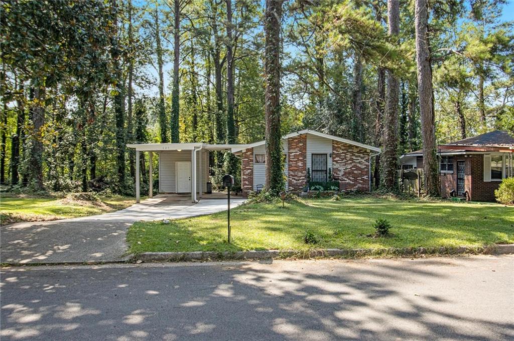 Welcome to this charming Atlanta home situated on a large, flat lot offering endless possibilities for outdoor living, play, or future expansion. Step inside to find a spacious layout with great natural light, comfortable living areas, and a functional kitchen ready for your personal touch. The property’s prime location provides convenient access to major highways, shopping, dining, and schools, making it an excellent choice for homeowners or investors alike. Don’t miss this opportunity to own a home with both potential and location—schedule your showing today!