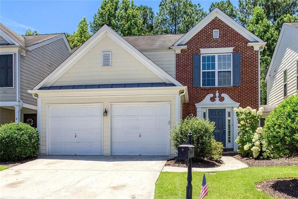 Discover the perfect blend of comfort, style, and privacy in this beautifully updated townhome located in the sought after Woodlands community. With no shared walls - each unit is uniquely seperated by individual storage spaces so you can enjoys the privacy of a single family home with the convenience of townhome living. From the moment you step into the welcoming foyer, you'll notice the attention to detail. New flooring was recently installed throughout the main level, fresh paint in every room, updated granite countertops, new stainless steel appliances in the kitchen, and a new hot water heater for added peace of mind. The open concept living area features a cozy fireplace with lots of windows overlooking the level backyard framed by mature, wooded views, providing a serene and private escape! The chef -inspired kitchen offers a large breakfast bar island ideal for entertaining, a spacious pantry, and a seamless flow into the great room, perfect for moden living! Additionally, a laundry room with built-in cabinetry is conveniently located on the main level. Upstairs, the luxurious primary suite features a large walk-in closet, and a spa-inspired bathroom with an oversized, glass-enclosed shower. Three additional bedrooms and a full bath provide ample space for famiy, guests, or a home office. The Woodlands community features resort like amenities including 2 pools, the main pool has water slides and a kiddie area, a club house, pickle ball, tennis courts, a playgorund and walking trails. Conveniently located near fabulous shops and restaurants, Downtown Woodstock, and easy access to Roswell, Alpharetta and East Cobb. Experience the charm, convenience, and community of The Woodlands - schedule your tour today!!!