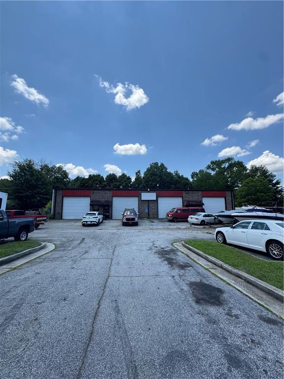 Dreaming of owning your own business? Situated in a sought-after area, this property enjoys high visibility and easy accessibility, making it an ideal location for businesses. Automotive shop with 5 Bays, 5000 Sq Ft. 2 separate meters, 2 separate entrances--ideal for owner to have tenants if desired. Plenty of parking. Current owner has been there since 1996. Don't miss out on this great opportunity.