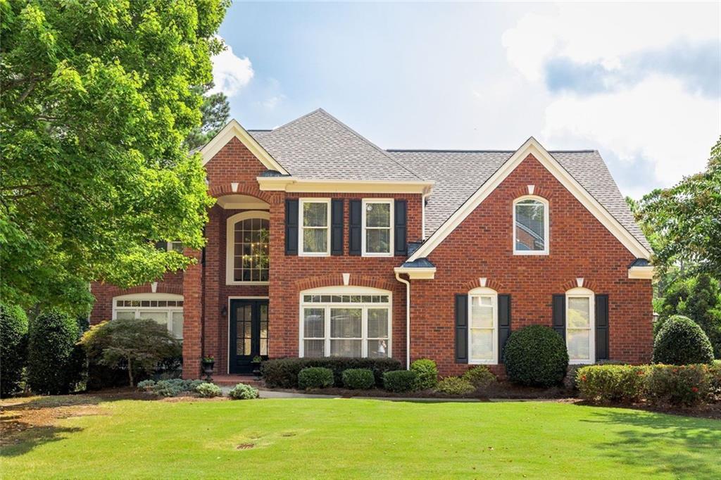 Stylishly remodeled, four-sided brick home in the conveniently located community of Whitehall. Only minutes to GA 400, Perimeter Center, Dunwoody Country Club and a variety of restaurants, parks, and medical services. Excellent schools and lower DeKalb County taxes. Built by John Wieland. Fabulous MAIN LEVEL features two story foyer, many new light fixtures, hardwood floors throughout, vaulted ceilings, and crown moldings. Remodeled kitchen with lots of storage and high-end KitchenAid, Bosch and Thermador appliances, oversized center island, gorgeous granite and new tile backsplash. Family Room features floor to ceiling stacked stone fireplace, and custom bookcases that span the length of the room. The main level is perfectly designed for entertaining! Enjoy a private, covered Trex deck for year-round entertainment featuring tongue-in-groove ceiling, fans, recessed lighting, and a linear gas fireplace with TV connections. UPSTAIRS with four spacious bedrooms, three full baths, hardwoods throughout and convenient laundry facilities. Primary Suite with beautiful bathroom and several spacious custom closets for incredible storage. Remodeled TERRACE LEVEL with home theater/media room, and bar/entertainment area. Fabulous guest suite with bedroom, sitting room and full bath. Additional laundry facilities and more storage. Terrific patio is perfect for grilling, dining, ping-pong and other games. You will love this beautifully remodeled home in this incredibly convenient location!!