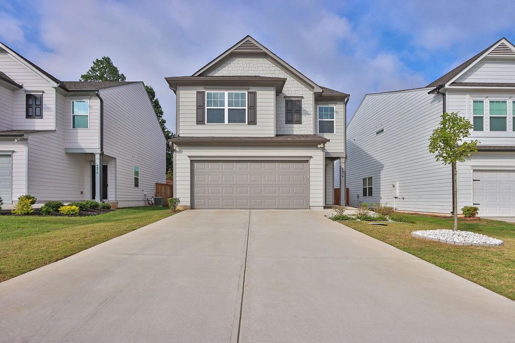 Welcome to this cozy 3 bedroom, 2.5 bathroom home, nestled in a tranquil neighborhood. Brannon Ridge is located in the vibrant South Hall County near Lake Lanier and Flowery Branch. The open-concept living area is filled with natural light and features a large dining area, ideal for gathering with loved ones. The kitchen comes equipped with an island, essential stainless steel appliances, making meal prep a breeze. Enjoy the comfortable, open master bedroom with a walk-in closet. Two-car garage and WHOLE HOUSE WATER FILTRATION SYSTEM. Step outside to a backyard, perfect for enjoying a peaceful morning coffee. Convenient access to Interstate 985, minutes away from shopping and dining in Gainesville, and nearby Lake Lanier is perfect for a weekend with friends and family. Enjoy a prime location near Lake Lanier, I-985, shopping, dining, and entertainment. MOTIVATED SELLER!