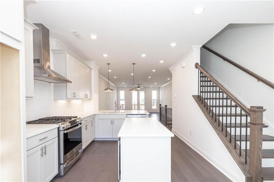 Season of Savings- Build your Savings and Unwrap the Joy of a New Home with $45K Promotion! ($45k incentive has been applied to list price). Promotions can be applied towards a price reduction, upgraded appliances, closing cost, Rate-Buy down and more- giving you the flexibility to save where it matters most. Ends November 30, 2025. Discover the The Barnsley I by The Providence Group. HOME IS COMPLETE - QUICK MOVE IN! Move in Package has been added - washer/dryer/refrigerator.  Come tour our vibrant community of townhomes and explore The Barnsley I floor plan featuring 2 Bedrooms / 2.5 Baths in the heart of Alpharetta, with a covered brick Terrace at the Front Entry. The welcoming brick terrace provides a great space to entertain and enjoy the outdoors right from the front of your home. Enter through the terrace-level into a spacious media room—perfect for movie nights, a home office, or a flexible living area. Designed for entertaining and relaxation, the media room features a built-in wet bar that adds both style and convenience. Upstairs, the open-concept main level features seamless flow between the kitchen, dining, and family room, ideal for everyday living and entertaining. Beautiful hard surface flooring extends throughout the main level, adding a sleek, durable, and cohesive look. Large windows bring in natural light, enhancing the room’s warmth and connection to the adjacent kitchen and dining areas for effortless flow. Step directly from the family room onto a spacious deck, perfect for indoor-outdoor living and entertaining. This seamless extension of the main living space offers the ideal spot for dining or relaxing while enjoying the fresh air. This stunning designer kitchen is a true showpiece, featuring pale gray cabinetry that offers a clean, timeless look. Two spacious islands provide abundant prep space and seating—ideal for entertaining or everyday functionality. Sleek quartz countertops add elegance and durability, while stainless steel GE appliances deliver modern performance. The upper floor features two generously sized bedrooms, each with its own private en-suite bath, offering comfort and privacy for residents or guests. Thoughtfully designed for functionality and convenience, this layout is perfect for shared living arrangements, families, or hosting overnight visitors while ensuring everyone has their own personal retreat. The spacious primary bedroom offers a serene retreat, complemented by a beautifully designed en-suite bath. The bathroom features a dual vanity with ample counter space and storage, perfect for everyday convenience. A standout feature is the large frameless walk-in shower, combining sleek, modern design with a spa-like experience. This home includes a convenient 1-car garage offering secure parking and extra storage space. An extended driveway provides additional parking, making it easy to accommodate guests or multiple vehicles. Walkable to many restaurants, shopping and entertainment. 2 miles or less to Avalon and Downtown Alpharetta. Big Creek Greenway and Wills Park are a quick drive. Ecco Park is very dog friendly with dog stations, green space, pocket parks and sidewalks through wooded areas. Virtual Tour of previously built Barnsley plan. [The Barnsley I]