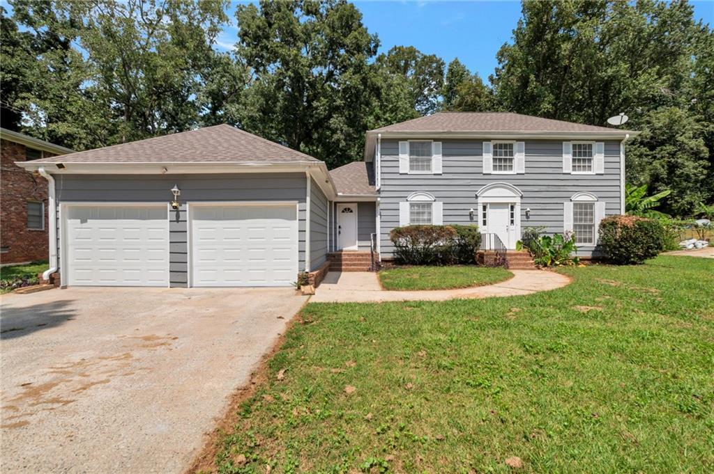 Welcome to 4570 Craghill Cir, a beautifully maintained 4-bedroom, 3-bath home on nearly half an acre in Stone Mountain. This spacious residence features gleaming hardwood floors, a cozy fireplace, and a bright, open layout perfect for both everyday living and entertaining. The kitchen offers granite countertops, stainless steel appliances, and plenty of cabinet space, while the expansive backyard provides a wonderful setting for outdoor gatherings or play. An attached garage adds convenience, and the location offers easy access to parks, schools, shopping, and major highways—making this move-in ready home an exceptional opportunity. Schedule your private showing today!