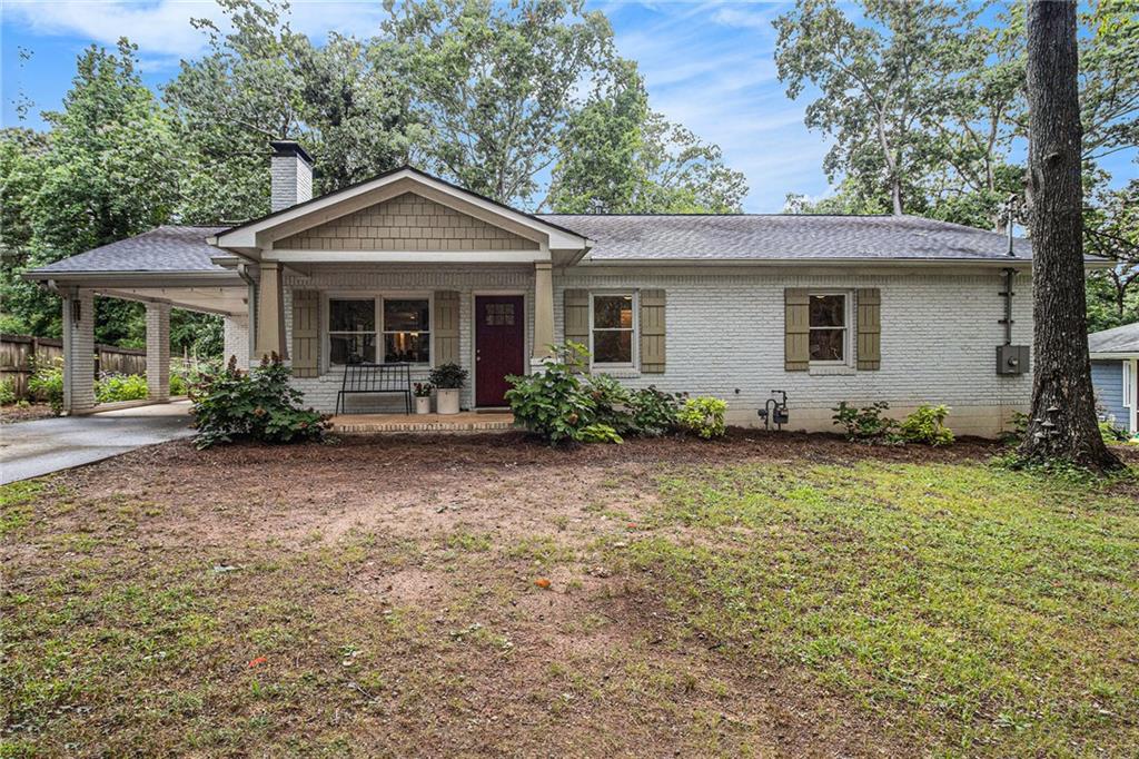 EXPERIENCE the Heart of this Charming 4-sided brick Bungalow in Decatur's desirable Midway Woods neighborhood. This spacious 4-bedroom home features thoughtfully designed living spaces, perfect for gathering and entertaining. A welcoming front porch opens into a cozy fireside living room with high ceilings and hardwood floors throughout. The open-concept floor plan connects the chef's kitchen - appointed with a breakfast bar, pantry, beautiful cabinetry and stone counters - to an inviting dining area and family room, creating curated spaces for every occasion. Retreat to the expansive owner's suite, complete with a large walk-in-closet and a luxurious en-suite bath featuring a soaking tub and glass surround shower. The private backyard is a gardener's delight welcoming an abundance of birds and butterflies as well as home grown vegetables! The large shed is perfect for additional storage or a workshop. Located near vibrant Decatur restaurants, parks, and trails, this move-in ready home delivers comfort, style, and effortless convenience - only minutes from downtown Decatur, Avondale Estates, Emory and the CDC. This gorgeous home allows you to discover the perfect blend of classic bungalow charm and modern living!