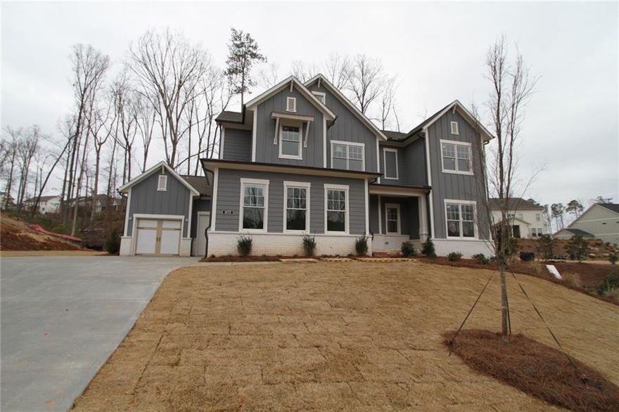Step into this inviting Sonnett floorplan home with a charming farmhouse exterior on a unique homesite that offers endless possibilities. The side-entry unfinished basement is the perfect canvas for creating a future in-Law suite or basement apartment, making this home truly versatile.

As you walk out from the main floor onto the covered patio, envision hosting gatherings and creating memories. The stunning kitchen is a true entertainer's dream with stacked cabinets, two-toned Wellborn cabinets, and GE Profile Kitchen Appliances. The full guest suite on the main floor provides a welcoming space for visitors, while the large family room with a designer electric fireplace exudes warmth and comfort.

Engineered hardwood flooring flows throughout the home, with plush carpet only in the secondary bedrooms for added coziness. Upstairs, the large retreat/loft offers a perfect playroom or movie theater space, while the Jack and Jill bedroom setup and additional guest suite across the hall provide ample room for everyone.

The spacious utility room adds convenience to your daily routine. At the same time, the vaulted ceiling in the owner's retreat sets the stage for a spa-like experience in the luxurious owner's bathroom featuring a Super shower. And don't forget the oversized walk-in closet for all your storage needs.

This home is more than just a house - it's a place where memories are made, laughter is shared, and dreams come to life. Come and experience the warmth and comfort of this home - your perfect sanctuary awaits.