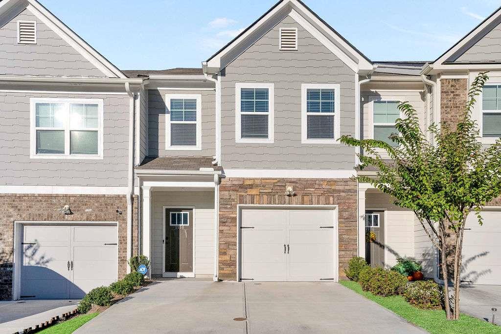 Luxurious Living Meets Exceptional Value - $9,000 in Lender Incentives for Conventional Buyers + 100% FHA Financing Available! Discover the perfect blend of style, comfort, and convenience in this beautifully appointed 3-bedroom, 2.5-bath townhome located in the highly sought-after Princeton Ridge Community in DeKalb County. This exquisite residence offers up to $9,000 in lender incentives for conventional buyers in addition to seller incentives, and 100% FHA financing with no down payment for qualified buyers (620+ credit score required). From the moment you enter, you're greeted by rich hardwood flooring and a stunning gourmet kitchen complete with gleaming granite countertops, stainless steel appliances, and an upgraded pantry accented by custom lighting. A stylish half bath and elegant wrought iron staircase with hardwood steps add to the refined aesthetic of the main level. Upstairs, the luxurious owner's suite is a true retreat, boasting tray ceilings, custom walk-in closets, and a spa-like en suite bathroom featuring double granite vanities, a soaking tub, a separate shower, and tasteful custom wall accents, lighting, and hardware. Two additional bedrooms, a full bath, and a convenient upstairs laundry room complete the upper level. Enjoy your own private oasis with a fenced-in rear patio, ideal for outdoor dining or entertaining. Additional features include a one-car garage, guest parking right in front, and a prime location just minutes from I-20 and the Stonecrest shopping and dining district. This is more than just a home-it's a lifestyle upgrade. Don't miss this incredible opportunity to own a move-in ready, upscale townhome with unmatched incentives!