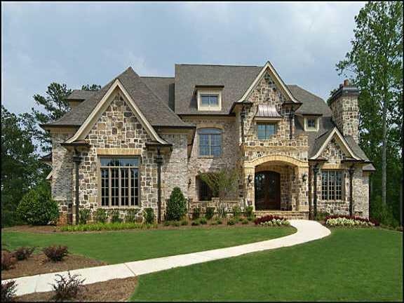 Stately European home with curved grand staircase. Vaulted and paneled study. Dramatic master retreat with morning kitchen and his/hers bath. Five fireplaces. Partially finished terrace level. Covered Lanai w/Golf Course View. Rear stairs. Huge kitchen/breakfast/keeping area.
