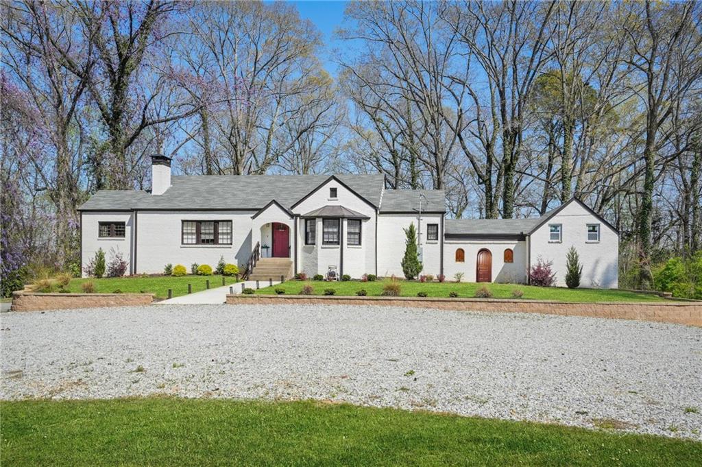 PRICED NEARLY HALF OFF APPRAISED VALUE! Gated 3,000+ sq. ft. home on almost 7 acres with a flexible Carriage House completely ideal for a guest suite or creative studio. Features include a spa-inspired European primary bath, oversized walk-in closet, unfinished attic + partial basement for expansion, and updated systems with a new vapor barrier & insultation. Just 15 minutes to the airport and under 30 to Downtown Atlanta. A rare opportunity that wont last long