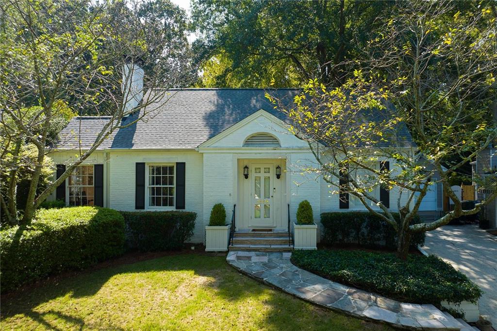 Situated on a desirable street in the vibrant neighborhood of Collier Hills, this beautifully renovated home blends sophistication with seamless living, offering an open floor plan that is ideal for entertaining. Upon entering, a charming foyer welcomes you, leading to a spacious formal living room adjacent to a sunroom, perfect for an office or playroom. The formal dining room, ideal for hosting, opens to a charming patio and garden. The fully renovated kitchen is a chef’s delight, featuring quartz counters, a large island, and an adjacent bar fitted with floor-to-ceiling cabinetry, ensuring ample counter space and storage. The family room has French doors that open to a flat backyard, allowing for effortless indoor-outdoor living. The primary suite offers a walk-in closet, and the marble en-suite primary bathroom boasts an oversized shower and spacious vanity. Important upgrades include: whole house water filtration system, newer sewer line, electrical upgrades and new sub-panel, encapsulated crawl space, 2 dehumidifier systems. Located steps away from Tanyard Creek Park, Playground, and The Beltline, this home provides an opportunity to experience life in one of Atlanta’s most charming and dynamic neighborhoods. With proximity to both Buckhead and Midtown, the sought-after location of this Collier Hills gem is unparalleled.