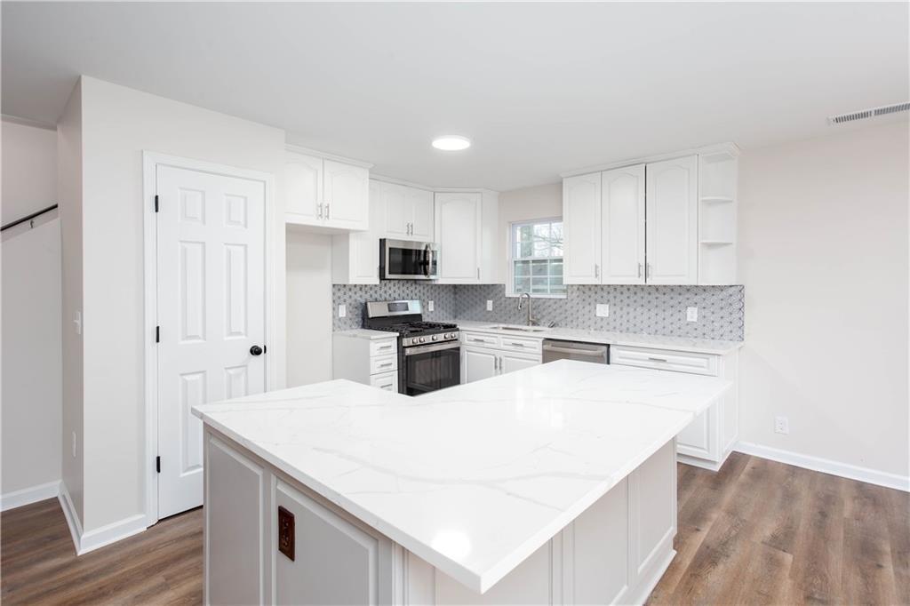Save money when you buy this home by using our Preferred Lender, Darryl White of Edge Home Finance (m: 770-335-5078, NMLS ID 2186361). Tell him you are interested in a Southern Girl Home Buyers’ home and ask about $0-Down financing, 1%-Down Conventional mortgages, Rate Buydowns, how to get Low-to-No Closing Costs, and other financing options available to our home buyers through August 31st. Act quickly and you could make this your home by Labor Day.
PRICED TO SELL, below appraised value and tax assessment value. Welcome home!! This beautifully more new than old, renovated 4/3 with the master-on-main boasts extensive upgrades, including a new roof, garage doors, electrical system, kitchen featuring sleek quartz countertops, pantry, and island with a bar, as well as luxurious vinyl plank (LVP) flooring and plush carpet throughout. Enjoy the comfort and reassurance of a new HVAC system and enhanced spray foam insulation that will cut energy cost drastically. Substantial updates have been made to the plumbing and siding, with all work completed under permit and certified with a final Certificate of Occupancy. The spacious attic has been transformed into a functional living area, offering a bonus room, additional bedroom, and a full bathroom. This home has been thoughtfully restored to combine modern amenities with a new feel. Schedule your showing today and experience contemporary living at its finest.