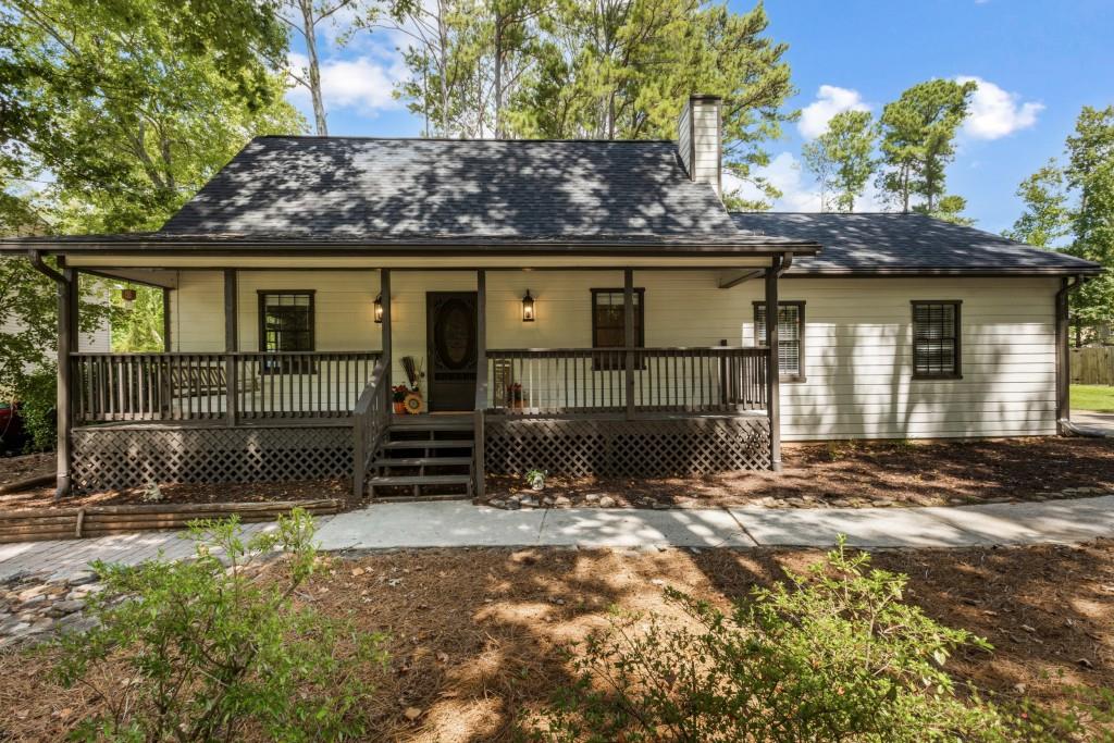 Welcome to this beautifully updated 3BR/2.5BA home in desirable Cobb County, offering convenience, charm, and modern updates just minutes from shopping, dining, Truist Park, Cumberland Mall, Wellstar, and Kennesaw Mountain trails. The main level features a generous living room and a formal dining room highlighted by a beautiful fireplace, plus a well-appointed kitchen with pantry and ample storage. The primary suite includes a beautifully updated bath with a walk-in shower and modern design details. Upstairs, enjoy 2 spacious bedrooms, an updated full bath with tub, and a versatile bonus room ideal for an office, playroom, or studio workshop. Step outside to a private backyard retreat with 3/4 acres of scenic backdrop and an oversized deck perfect for entertaining or relaxing. For added peace of mind, the home has a new architectural roof, has been professionally inspected and includes a transferable home warranty. Fresh renovations, timeless charm, and ubeatable location make this move-in ready home a must-see! A complimentary property appraisal for this home is available to buyers who obtain financing through Summerfield Mortgage, LLC. Seller is a licensed real estate agent in the State of Georgia, acting as Principal.
