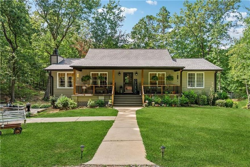 Don't miss out on this beautifully done raised ranch that has been so loved by one owner. It's time for this 6.43 acres to be home to a new family that will love it as much as the Seller's family has! The 3 bedroom, 2 bath home sits on a daylight unfinished basement so there is room to grow if you need additional bedrooms or flex space. The first thing you'll see upon entering is the large stately great room with floor to ceiling wooden bookshelves flanking a gorgeous stone fireplace. Find the floorplan in the images and you can see the separate dining room just off the great room so you can enjoy the fireplace while you have dinner. An eat in, country kitchen connects to the dinning room and also leads out to the expansive multi-tier deck that overlooks the absolute DREAM of a backyard complete with a pond, dock, stalled building, garden and an adorable outbuilding that can be a playhouse for the kids or space for your chickens.  The Seller once had horses here so plenty of room for that if your horses need a home too.  The 2 car garage is currently open to the basement so if you have boats, jet skis, etc you would have space to pull them in and still have room for your vehicle. Being just a short trek to Allatoona lake who wants to pay extra to store when you have this space already?? If you begin at the road you'll notice two graveled entrances to the property that connect via a wrap around drive. Pulling boats, campers, etc are a breeze with the in and out drive. Each of the driveways serves the one home but if a second homesite is in the plan you can utilize the second drive and road frontage to build another home , barn, etc. Currently the property is using public water but was once on a well so the possibility remains for the next owner to have a well. 

Can't beat the location with an approximate 10 miles west to I-75 and 10 miles east to I-575. Shopping close in both Canton and Cartersville with easy access to boat ramps and campgrounds on  Allatoona Lake. The up and coming City of Emerson is a few exits away and you can be at a Braves game in close to 30 minutes. Come see this property where suburbia meets the country!