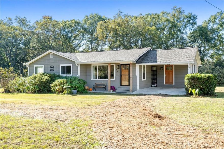 MOTIVATED SELLER!!  Work-From-Home & Workshop Ready!  Welcome to this beautifully updated residence, perfectly situated just minutes from Downtown Senoia. This home offers a rare and powerful combination of peaceful living and exceptional functional space.  Inside, you'll find quality features including hardwood floors, an open-concept kitchen with abundant natural light, a dedicated laundry room, and a mudroom with extra storage. The primary bedroom and ensuite bath are the ultimate retreat. The attached covered carport provides convenient everyday parking.

THERE'S MORE!  The Ultimate Flex Space:  The centerpiece of this property is the massive 1,200 sq ft detached garage. This air-conditioned structure is a huge asset, offering an incredible opportunity for a professional-grade workshop, storage for equipment or vehicles, a large-scale art or production studio, or any other endeavor requiring significant dedicated space. It's ready to handle your specialized needs, whether you are a mechanic, carpenter, creative professional, or serious hobbyist.

The nearly two-acre lot is private and usable, complete with mature fruit trees (pears, apples, muscadines). Enjoy the space to relax, garden, or expand. This lovingly maintained property is located for convenience: 40 minutes from Atlanta, 10 minutes from Downtown Senoia, and just two minutes from a lovely local park.

This is more than a home; it's a foundation for your life and work.