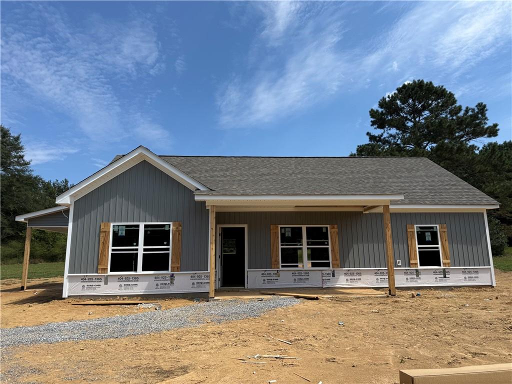 GORGEOUS NEW RANCH ON 3.832 PRIVATE ACRES – NO HOA, NO SUBDIVISION – JUST COUNTRY LIVING AT ITS BEST!!!
Limited-time offer: Get a FREE appraisal and $3,000 in incentives when you work with our preferred lender! (Ask listing agent for terms.)
Escape the hustle and bustle and come home to peace and privacy! This stepless ranch with attached carport is under construction on a picturesque 3.832-acre lot in the quiet countryside north of Buchanan, just off Hwy 27 heading toward Cedartown. Mostly cleared pastureland surrounds the home, and an old barn located behind the house adds extra character and charm.
Step inside to soaring vaulted ceilings and an open-concept layout that feels light, bright, and welcoming. With 3 bedrooms and 2 full baths, there’s plenty of room to spread out—and yes, there’s still time to make it truly YOURS!
Thoughtful selections throughout include modern gray tones, durable luxury vinyl plank flooring in main living areas, plush carpet in bedrooms, and stylish granite countertops. The kitchen is the heart of the home, featuring a counter-height bar and stainless steel appliance package (electric range, microwave, and dishwasher included!).
The private owner’s suite offers a large walk-in closet, double vanities with framed mirrors, granite countertops, and a beautifully tiled shower. Two secondary bedrooms share a stylish full bath with granite vanity and tub/shower combo. The family room is anchored by an electric shiplap fireplace, and ceiling fans add comfort in key spaces.
Outside, the home will showcase Sterling Gray siding with stone accents, wood-stained details, and Weathered Gray shingles for timeless curb appeal.
Don’t miss this rare opportunity to build your dream home in the country—with room to breathe and no HOA restrictions! Photos are representative and may not reflect the actual home. ***Construction is underway—contact the listing agent today!***