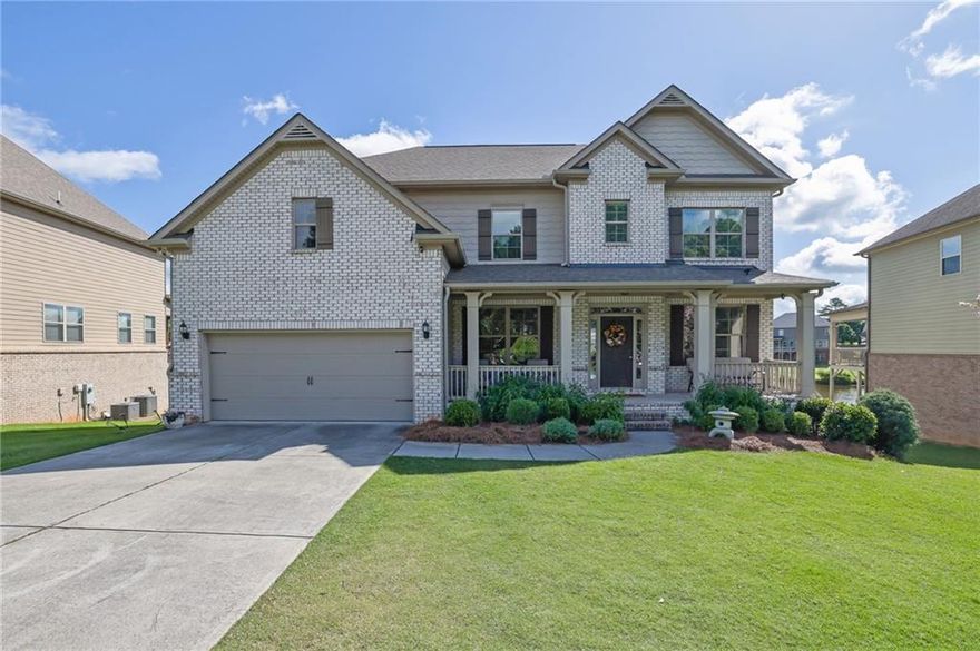 Welcome to your lakeside haven in Cumming, a traditional home upgraded with over $220,000 in renovations. This 4,831-square-foot residence offers 6 bedrooms and 5.5 bathrooms, with an open-concept main living area featuring  hardwood floors—perfect for family life or entertaining. The gourmet kitchen showcases bright, open design, granite countertops, a gas cooktop, and double ovens, making family meals and hosting effortless. Step onto the back deck to find a cozy outdoor fireplace and inviting living space, all overlooking a tranquil lake. The fully finished basement includes its own kitchen and a dedicated laundry room, plus spectacular lake views. Walkout patio for lake activities or a peaceful morning coffee. The oversized primary suite features a built-in home gym or reading nook for flexible use. Homes has a built-in Tesla charger for EV charging and an advanced home water filtration system for pristine, filtered water.

Residents enjoy exclusive access to the community pool, a perfect amenity for an active lifestyle and socializing with neighbors. This home blends traditional elegance with modern conveniences in a picturesque lakeside setting. Whether you’re relaxing on the deck, pursuing outdoor activities, or entertaining, you’ll find the ideal backdrop for your lifestyle.