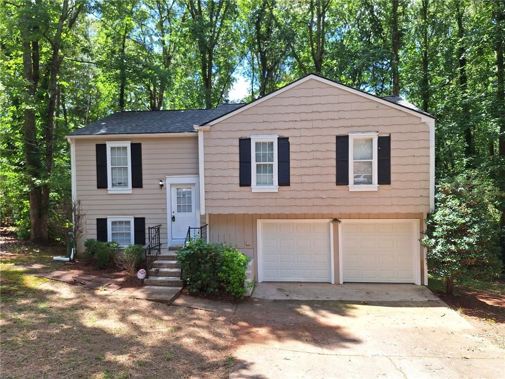 Welcome to this beautifully renovated 4-bedroom, 3-bathroom home that perfectly blends modern updates with timeless charm. Located in a desirable neighborhood, this home features an open-concept living area that flows seamlessly into a stylish eat-in kitchen complete with granite countertops, custom cabinetry, breakfast bar, and brand new stainless steel appliances.
Step down to the spacious family room, where you’ll find a cozy fireplace, large windows for plenty of natural light, and elegant French doors that lead to a deck and private backyard—perfect for relaxing or entertaining. This lower level also includes a full bathroom, laundry room, and garage access.
All three bedrooms are located on the main level, offering comfortable living and great layout. Each bathroom has been thoughtfully updated with granite countertops, custom cabinets, and beautiful tile finishes.