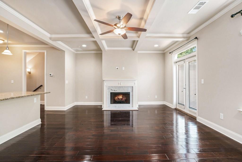 Stunning Townhome for Lease in Gated Laurel Gate Community! Discover the perfect blend of style, comfort, and unbeatable convenience in this beautiful Townhome located in the sought-after Laurel Gate community. Ideally situated just minutes from I-285 and I-75, Smyrna Market Village, Vinings Jubilee, Silver Comet Trail, The Battery/Truist Park, and an array of top restaurants and shopping destinations, this home offers easy access to everything you need. You'll also love being walkable to Tolleson Park with its Swimming Pool, Tennis Courts, Playground, Ball Fields, and Walking Trails. Zoned for award-winning King Springs Elementary and within the Campbell High School district, this location truly has it all. Step inside to discover a flowing main level filled with natural light and rich dark Hardwood Floors. The inviting Dining Room seamlessly connects to the Central Kitchen featuring Dark Cabinetry, Custom Tile Backsplash, Stainless Steel Appliances, Granite Counters, and a spacious Island with Breakfast Bar perfect for everyday meals and entertaining. The adjacent Family Room impresses with a Coffered Ceiling, Cozy Fireplace, and easy access to a Large Rear Deck ideal for outdoor relaxation. A convenient Half Bath completes the main level. Upstairs, retreat to the expansive Primary Suite showcasing a Tray Ceiling, Walk-In Closet, and a Spa-Inspired Ensuite Bathroom with Dual Vanities, Soaking Tub, and Separate Shower. A generous Second Bedroom offers Dual Closets and its own Private Ensuite Bath. The Lower Level provides a Large Bedroom with a Private Bathroom ideal for a Home Office, Guest Suite, or additional living space. Additional highlights include a Private Two-Car Garage for secure parking and extra storage. Don't miss the opportunity to lease this exceptional townhome in a prime Smyrna location!