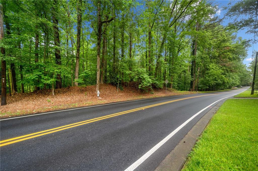 INCREDIBLE OPPORTUNITY TO BUY AND BUILD YOUR DREAM HOME ON SOUGHT AFTER SPALDING DRIVE. Lovely 1.45 acre lot with mature hardwoods and creek very close proximity to the Chattahoochee River.