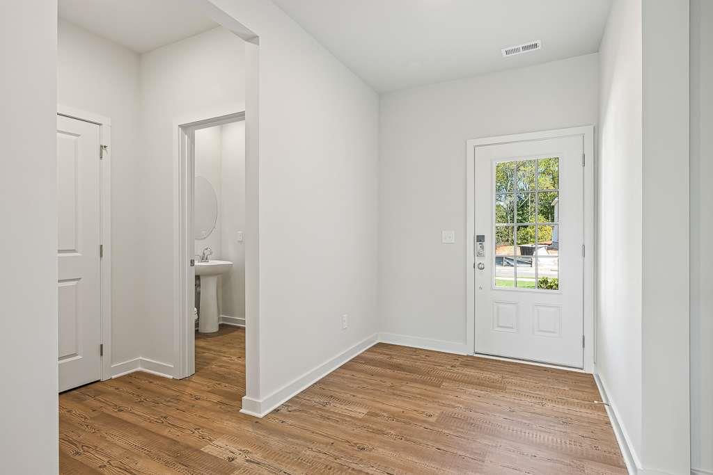 Experience Elevated Living with the Hazel at Ellorie Estates The stunning two-story Hazel floor plan embodies refined elegance and thoughtful design, offering the perfect blend of functionality and luxury. A welcoming front porch invites you into a grand open-concept main level, where soaring ceilings in the two-story great room create a dramatic focal point filled with natural light. The charming dining room flows seamlessly onto the patio-ideal for indoor-outdoor entertaining-while the chef-inspired kitchen features a generous center island, sleek cabinetry, and a spacious walk-in pantry. Just off the kitchen, you'll find a convenient valet entry from the garage, a dedicated laundry room. A thoughtfully designed guest suite on the main floor ensures comfort and convenience for visiting family and friends. The main-level primary suite is a serene retreat, showcasing a spa-like bath with dual vanities, a benched shower, and an expansive walk-in closet. Upstairs, the flexible layout continues with a central game room, ideal for media, play, or relaxation. Two secondary bedrooms each enjoy private en-suite baths and walk-in closets, while two additional bedrooms-also with walk-in closets-share a well-designed Jack-and-Jill bath. From everyday living to special occasions, the Hazel offers space, sophistication, and style at every turn.