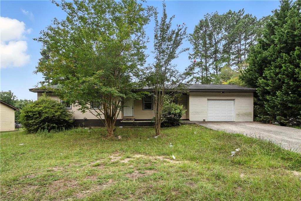 This home is ready for the next owner to bring it back to life. Whether as a flip, a rental, or a primary residence this home has potential. With 3 bedrooms and 2 bathrooms, a level, fenced backyard ideal for outdoor relaxation or entertainment, and an oversized one-car garage and a level driveway